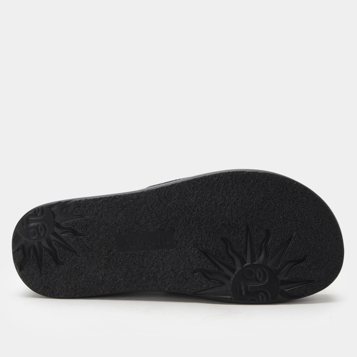 Black sandal sole on a light gray background