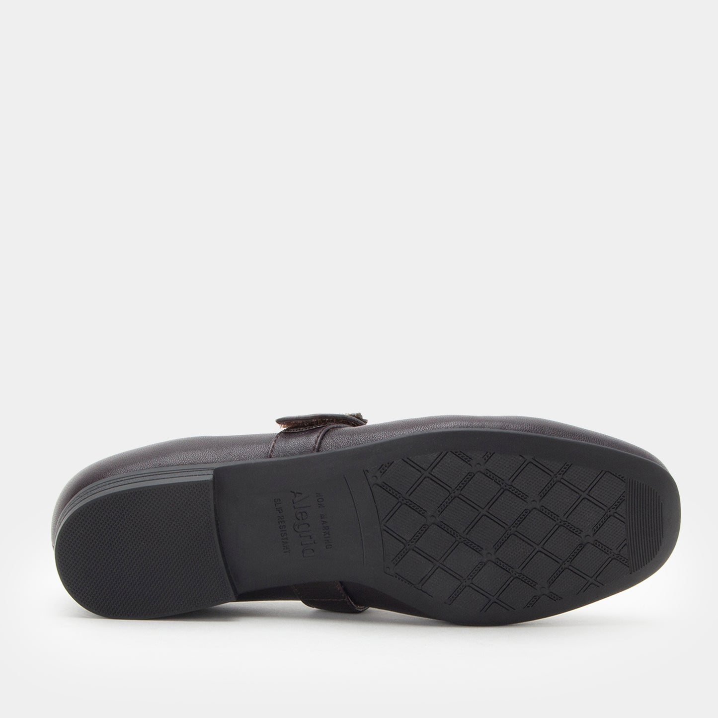 Black shoe sole with tread pattern on a white background