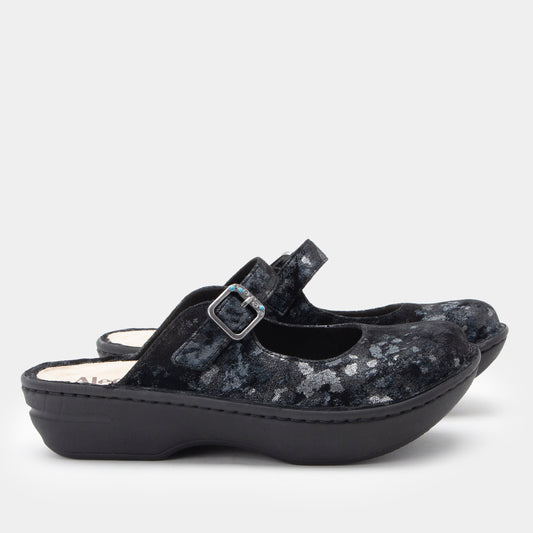 Black sandal with floral pattern on a white background