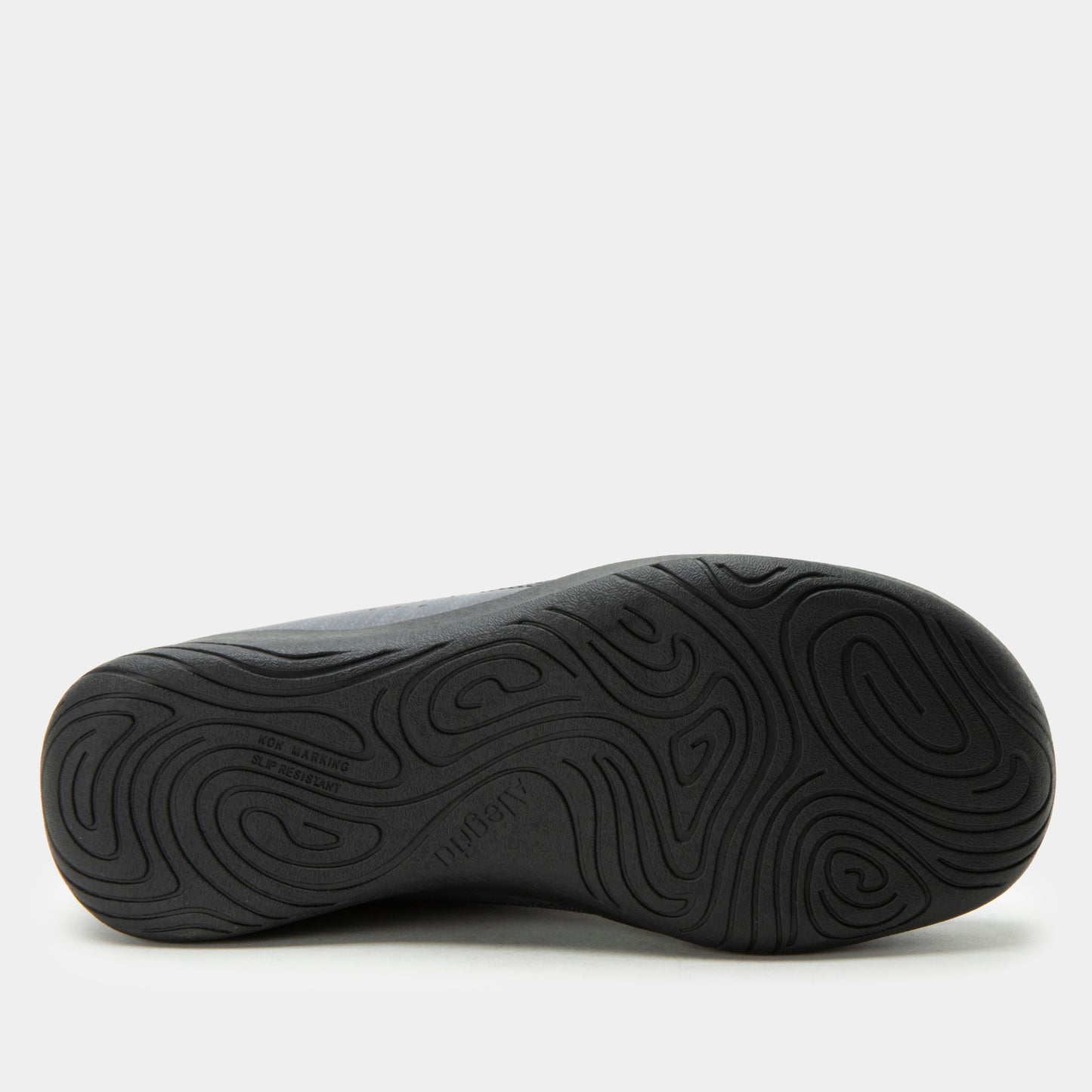 Black shoe sole with wavy tread pattern on a white background