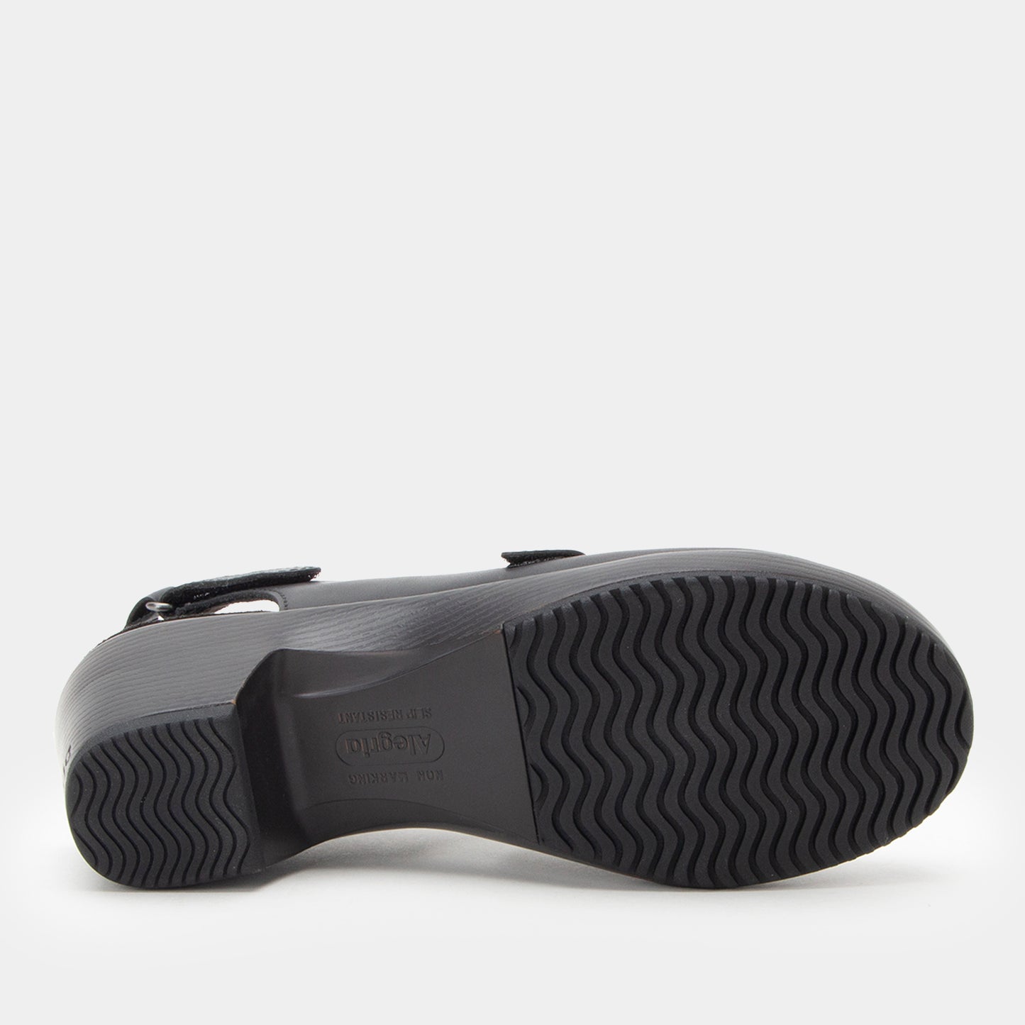 Black sandal with a textured sole on a white background