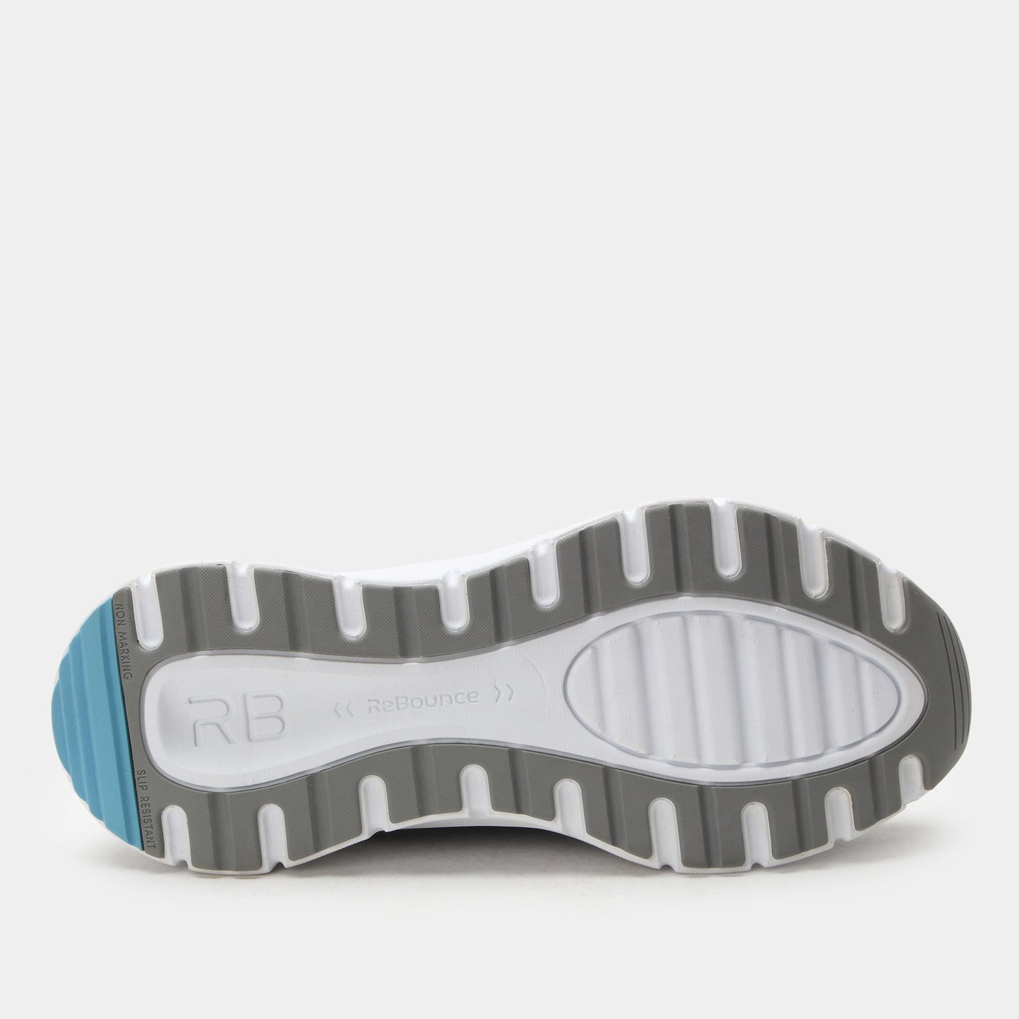 Close-up of a shoe sole with 'RB' branding on a light gray background