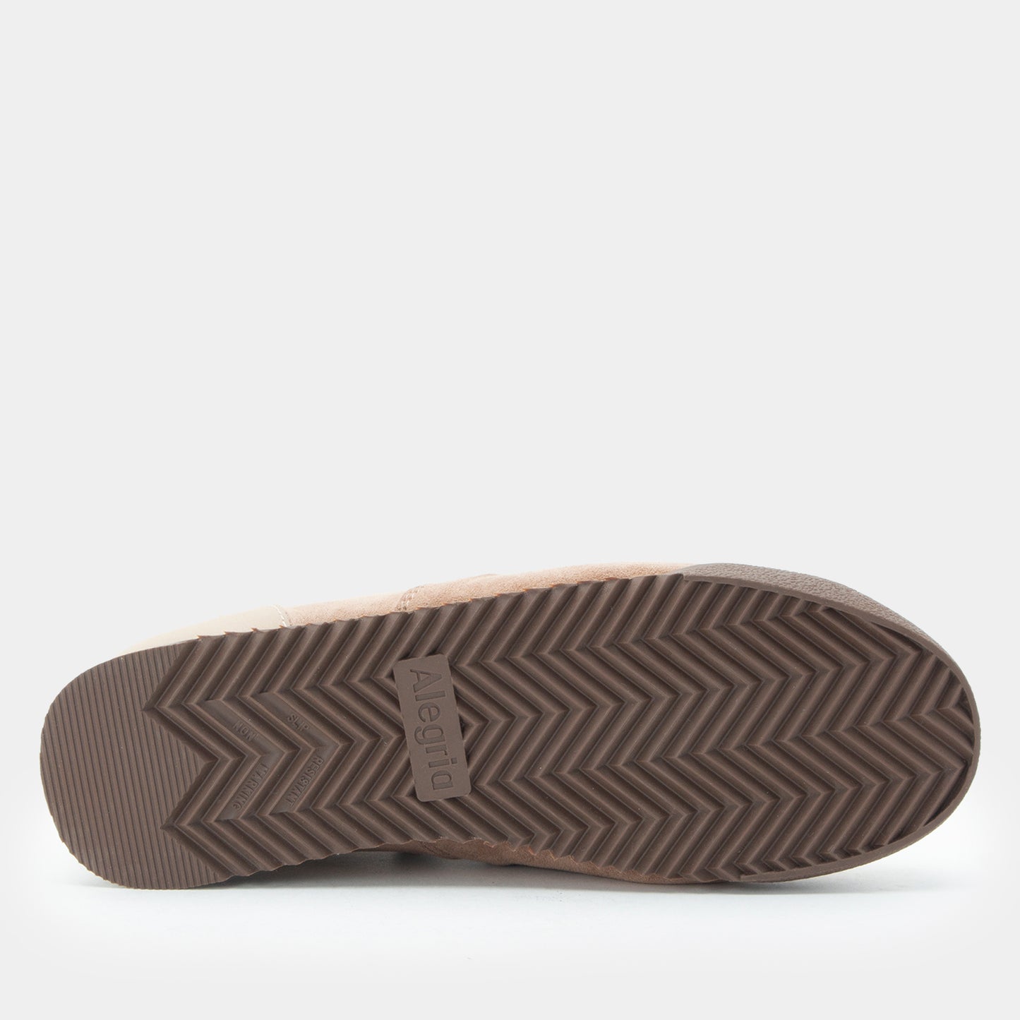 Brown sandal with textured sole on a white background