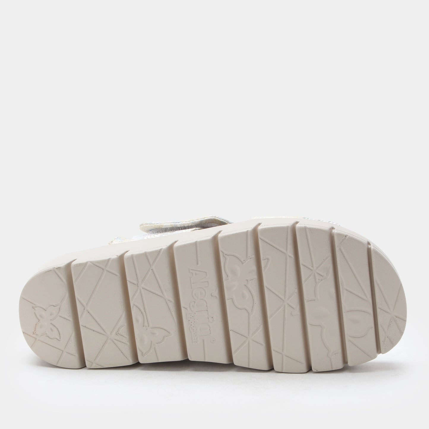 White sandal sole with embossed pattern on a white background