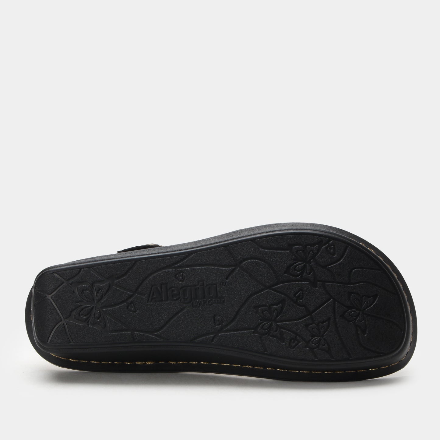 Black sandal with floral pattern on a white background