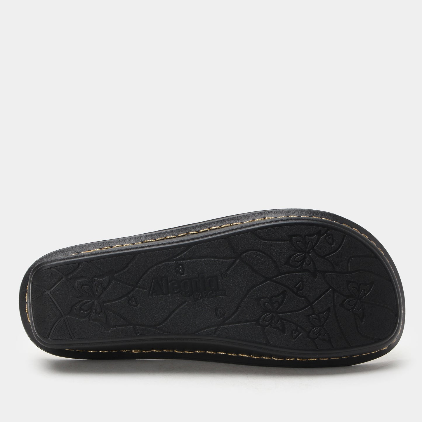 Black sandal sole with floral patterns on a white background