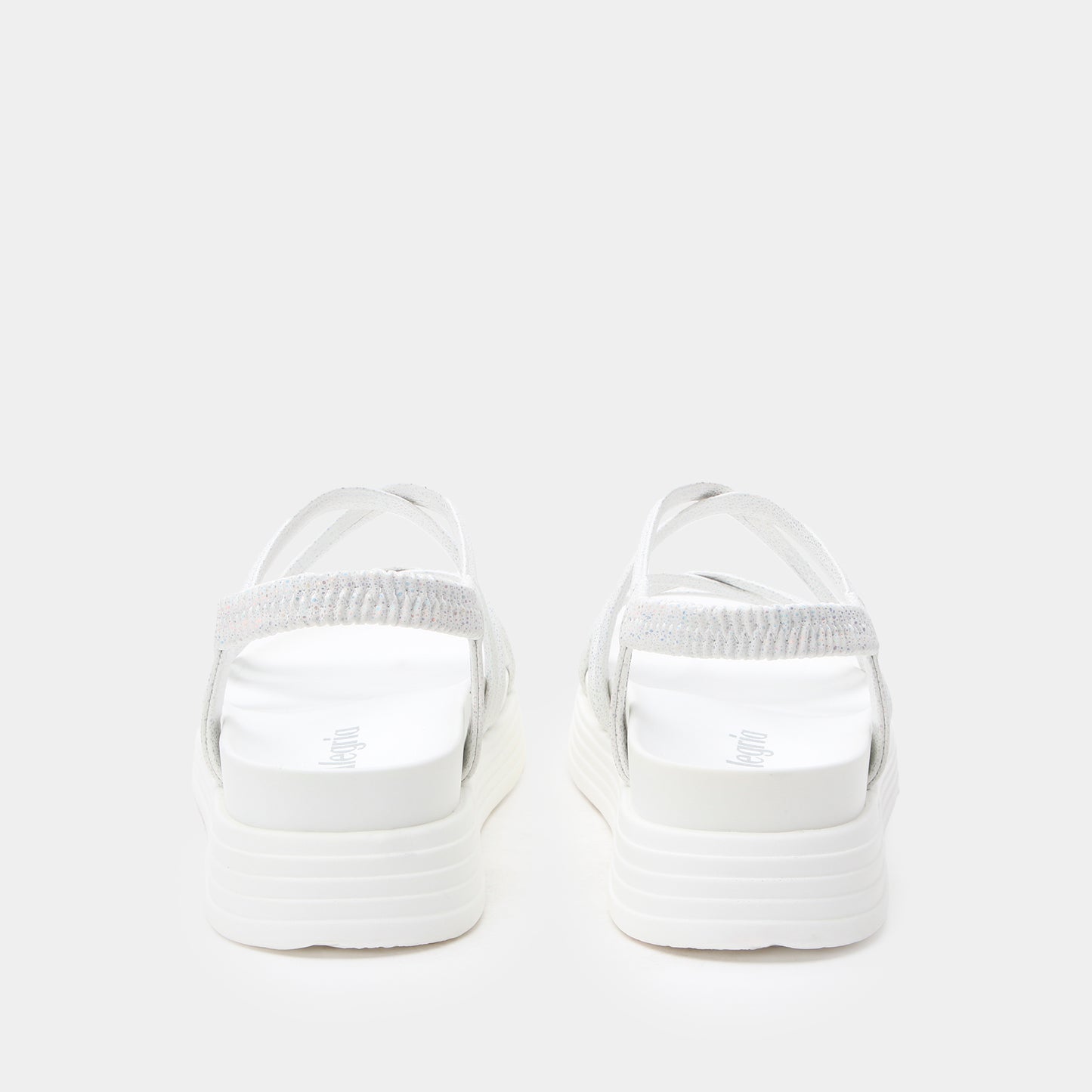White sandals with a thick sole on a white background