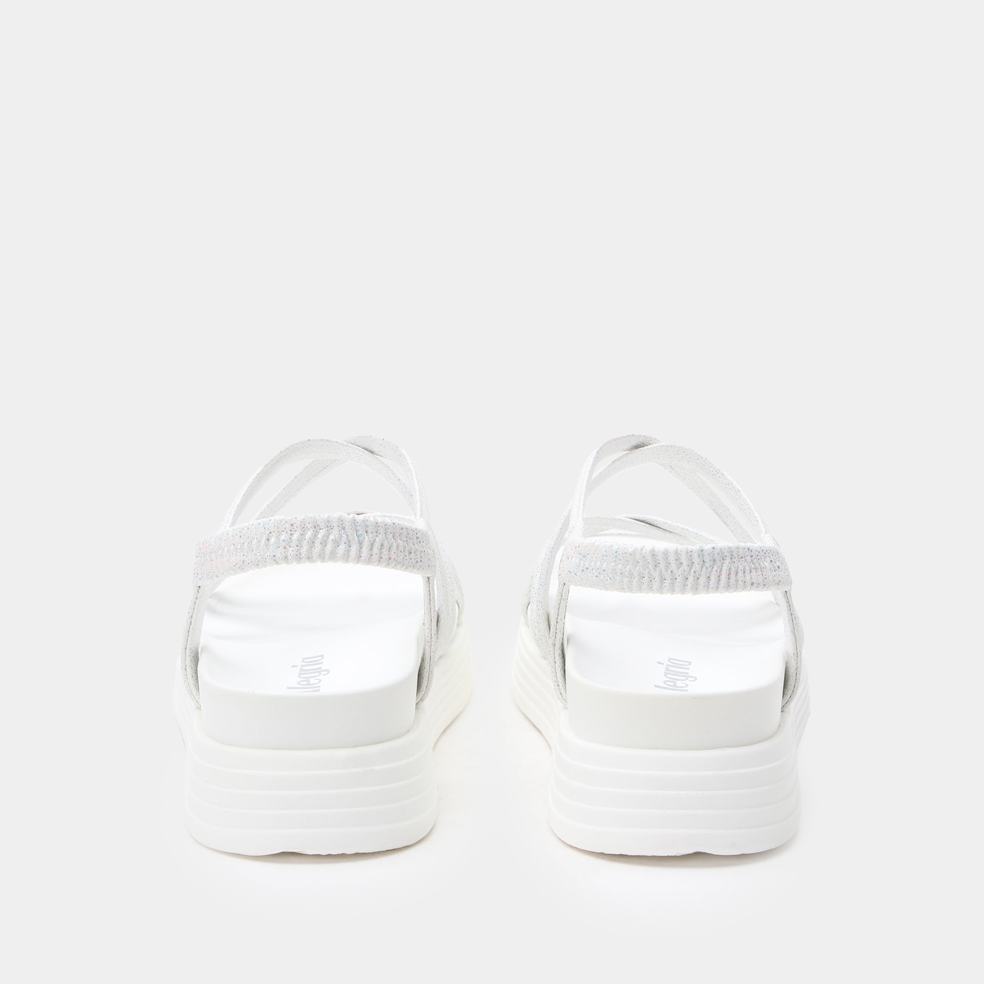 White sandals with a thick sole on a white background