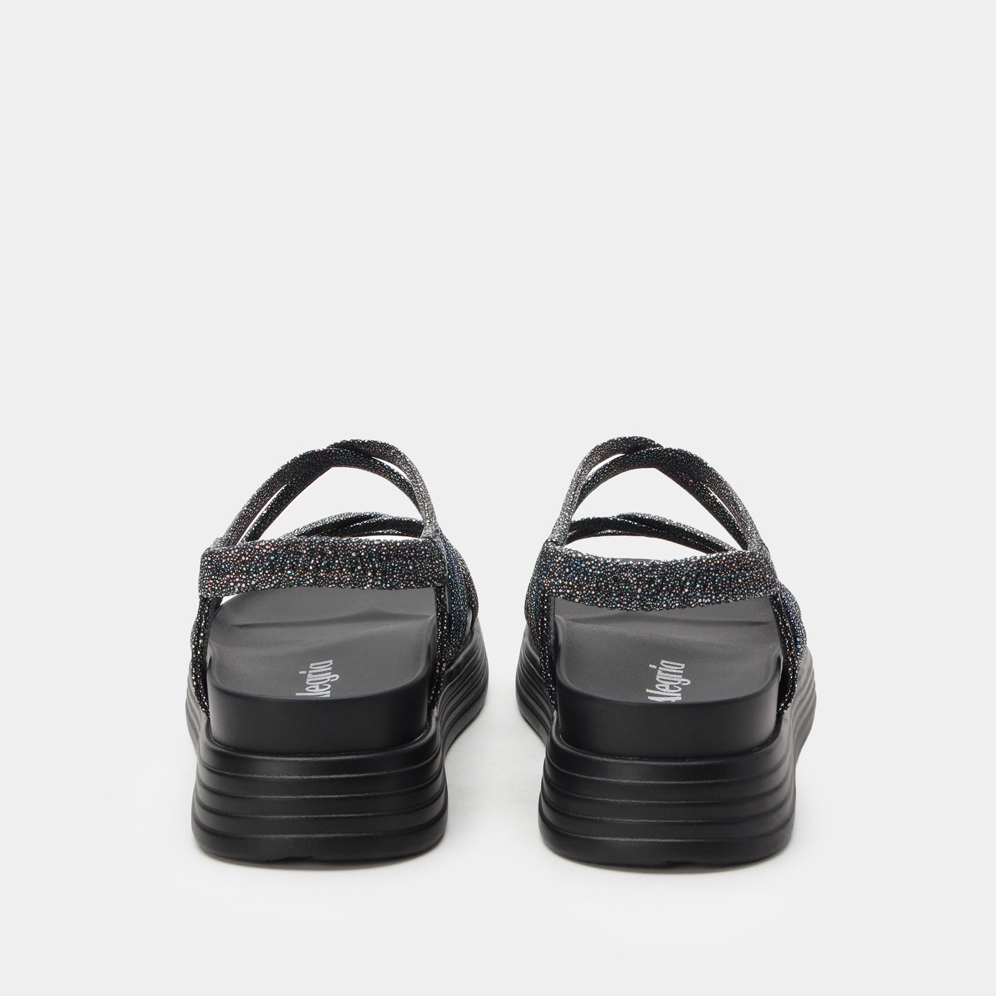 Black sandals with glittery straps on a white background