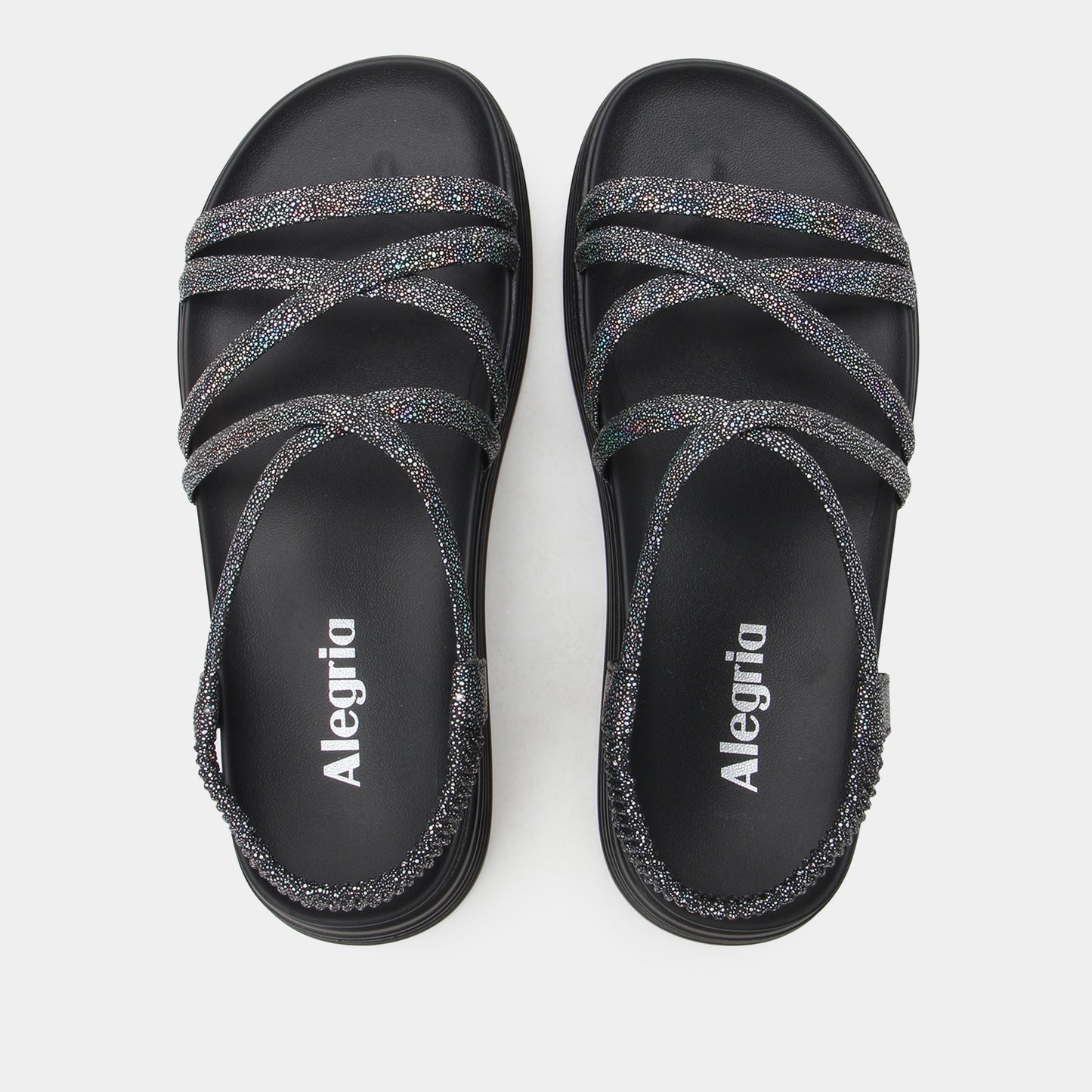 Black sandals with glittery straps and 'Alegria' branding on a white background