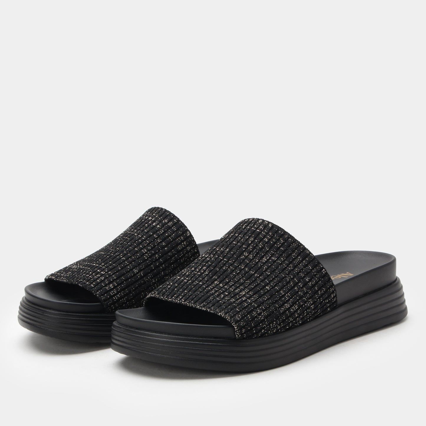 Black textured slide sandals on a light gray background