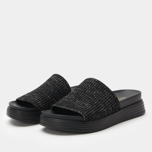 Black textured slide sandals on a light gray background