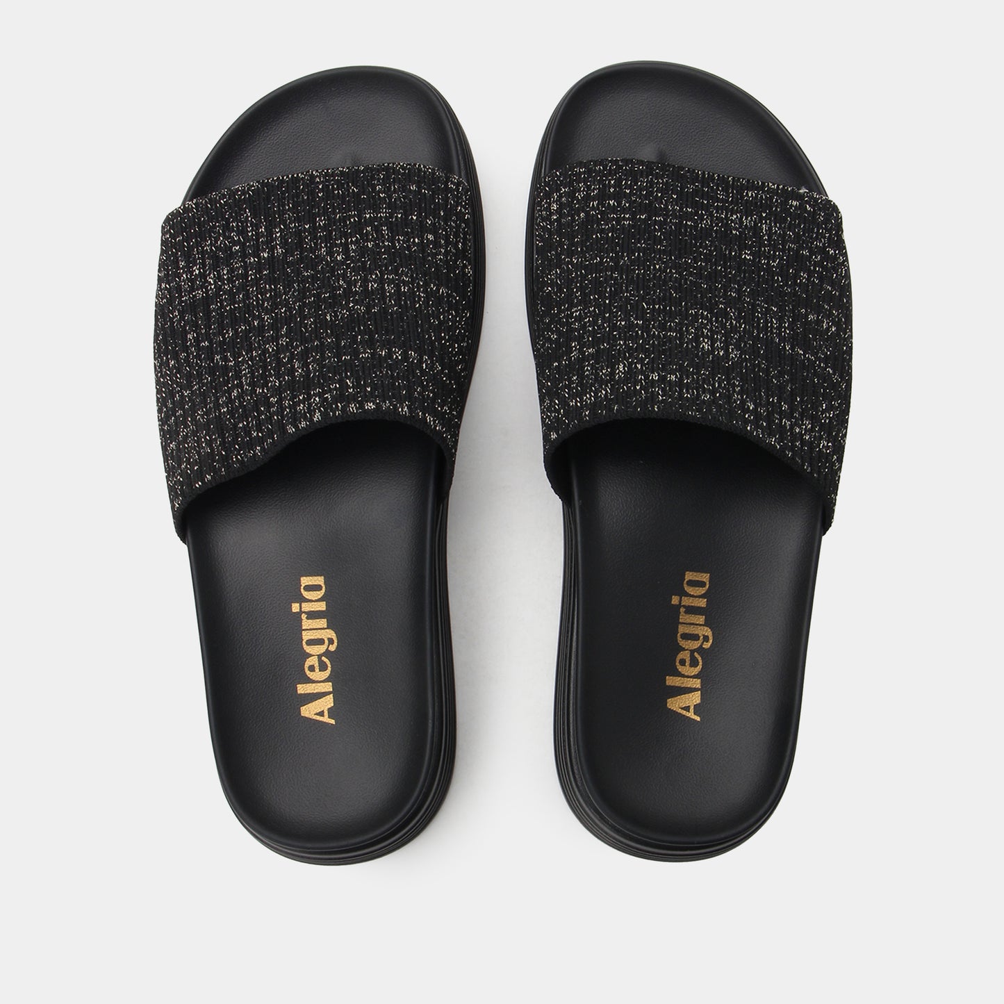 Black slide sandals with textured strap and 'Alegria' branding on a white background