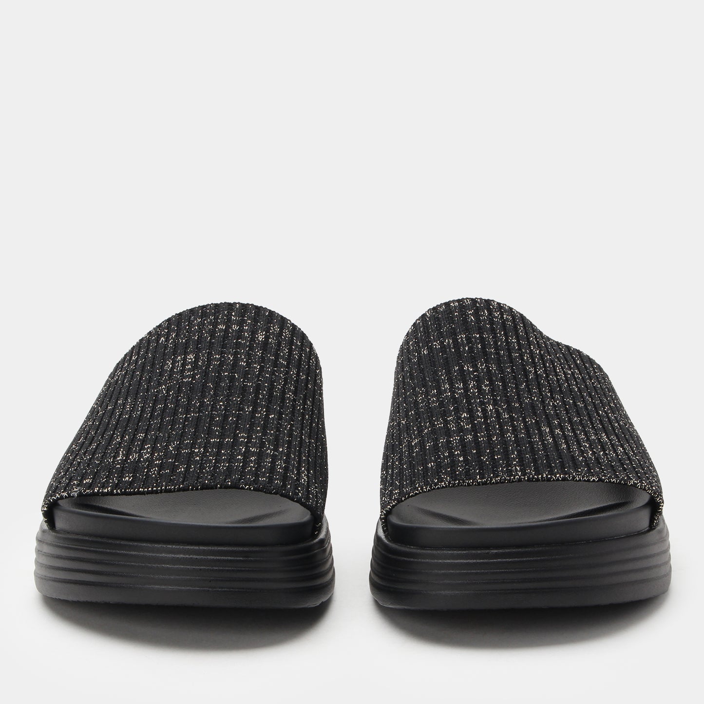 Pair of black textured slides on a light gray background