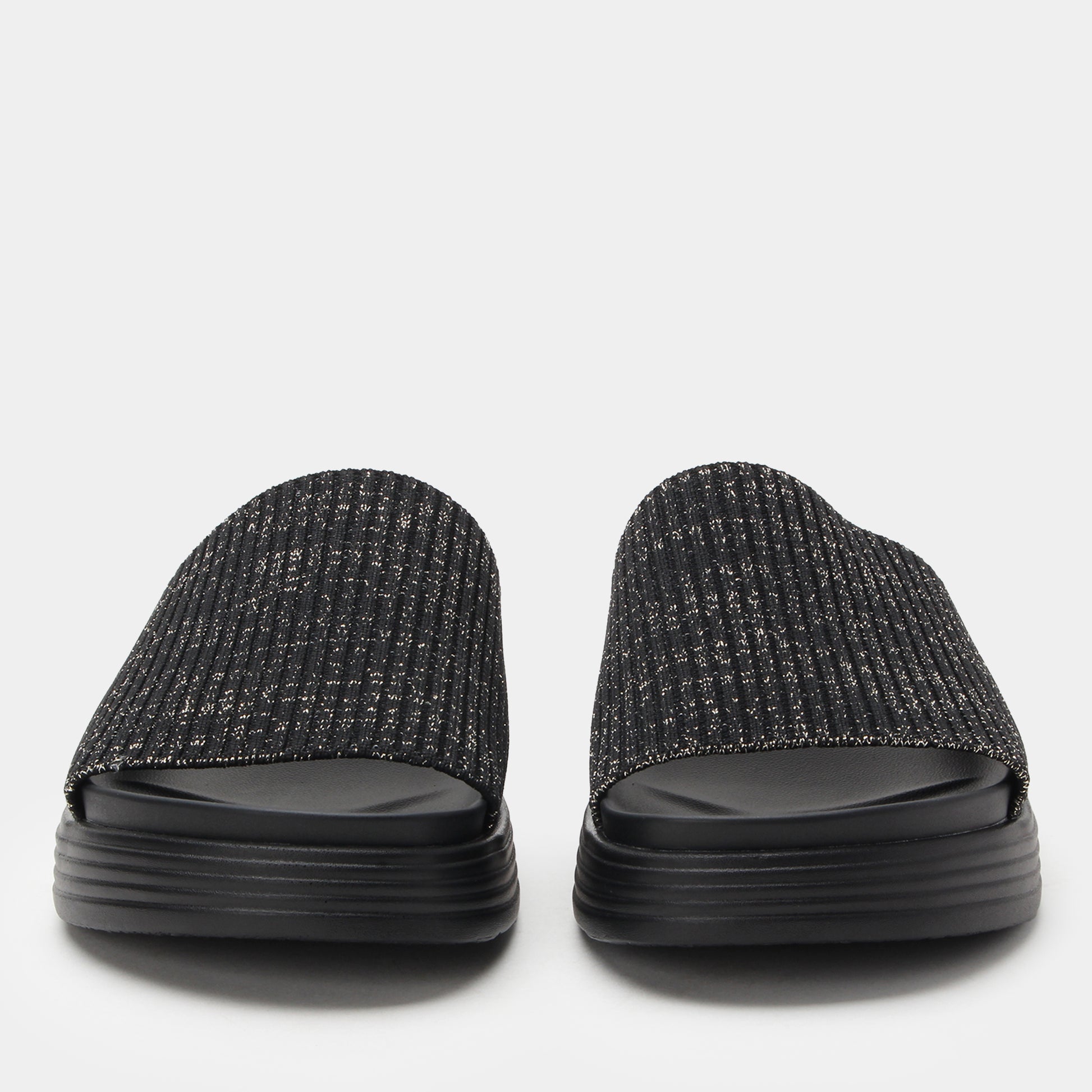 Pair of black textured slides on a light gray background