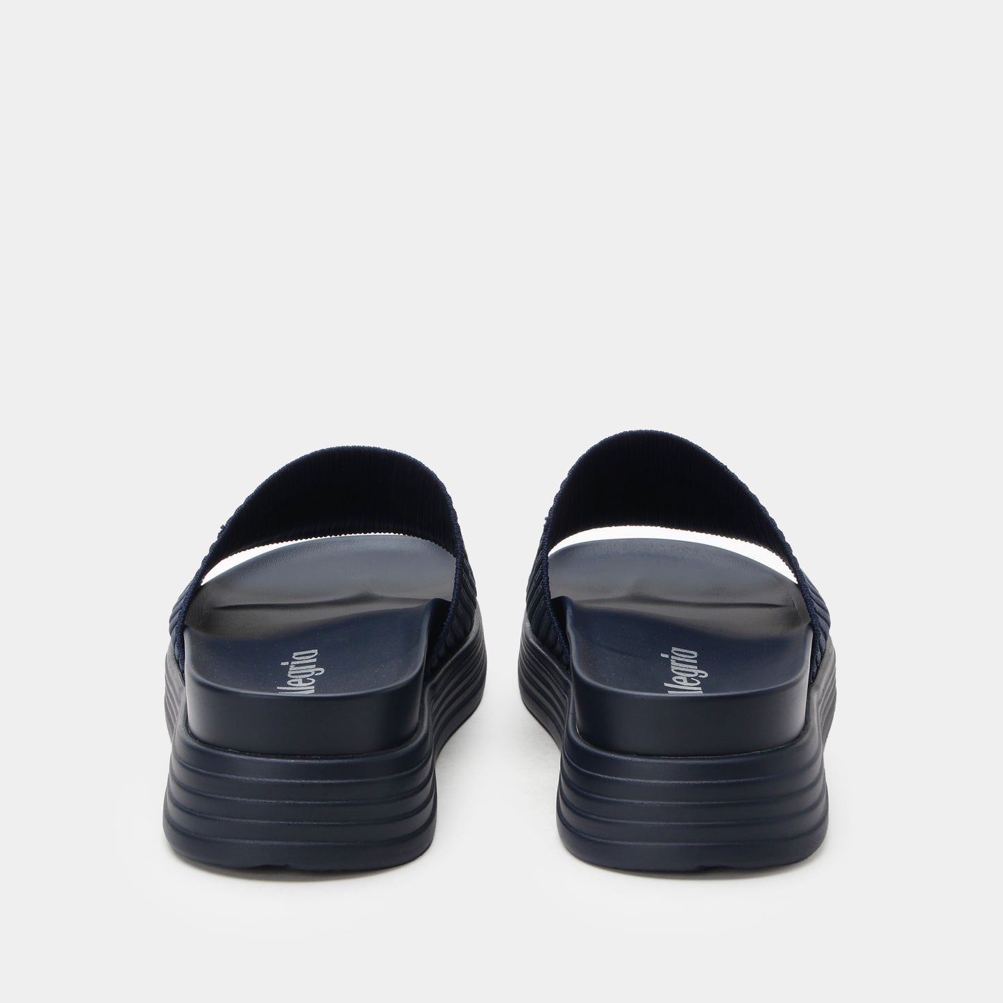 Black sandals with a platform sole on a white background