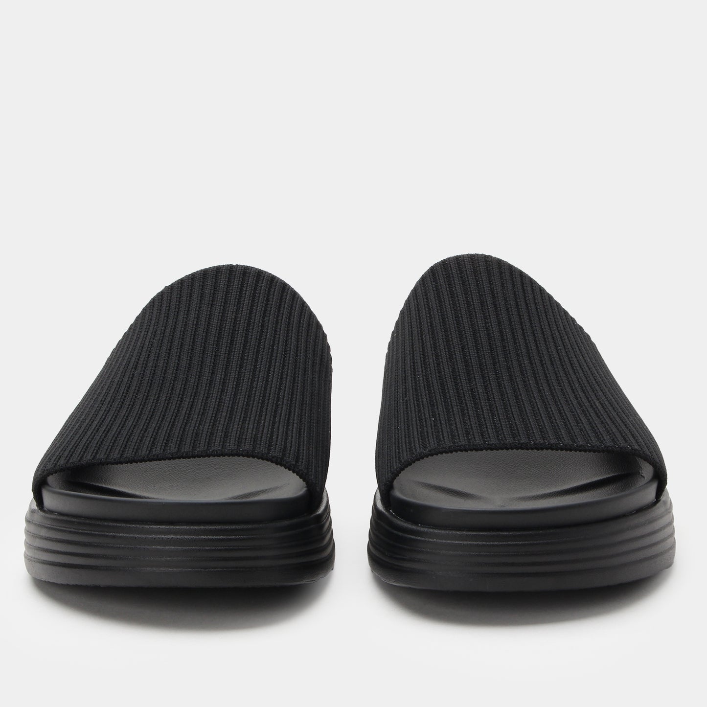 Pair of black slides on a light gray background