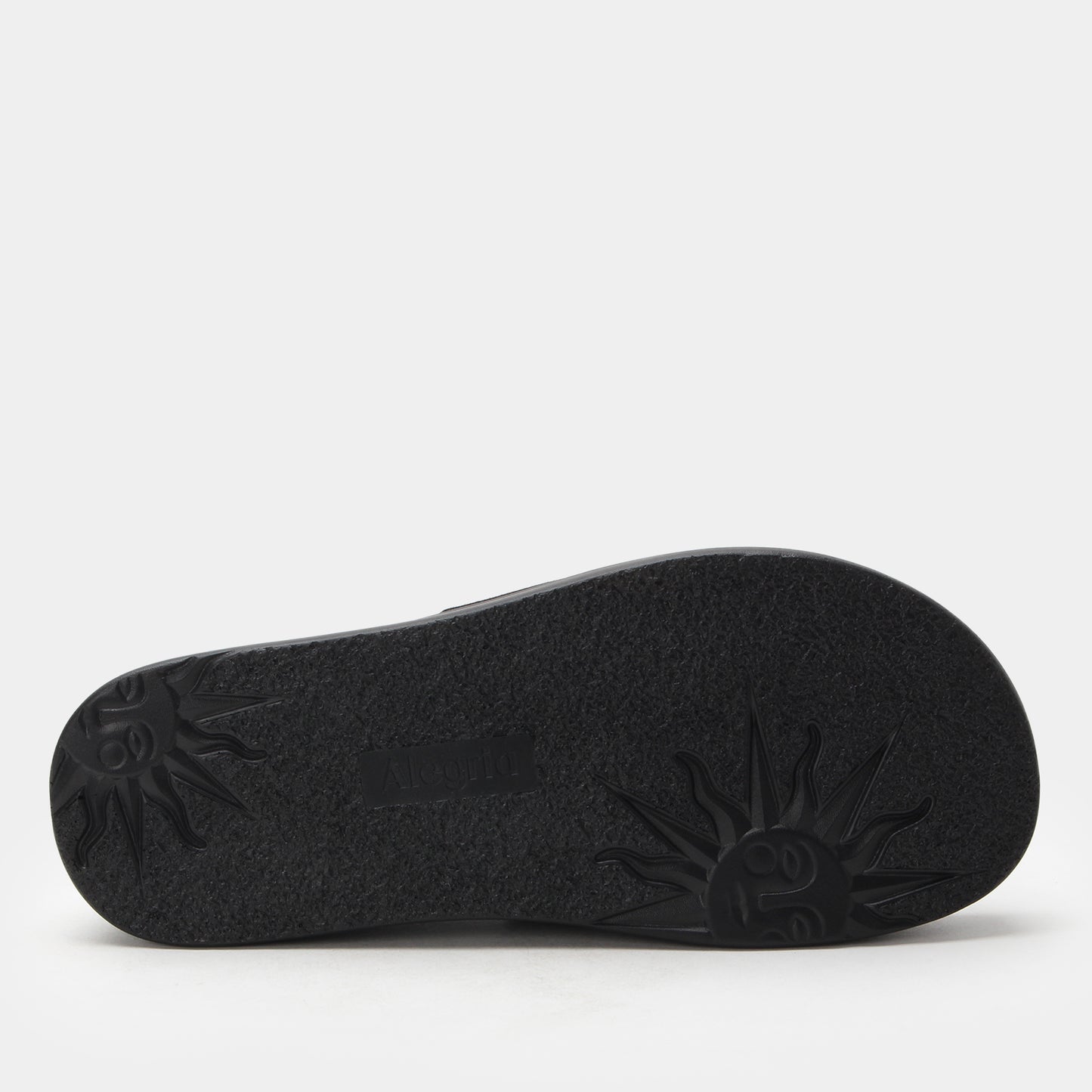 Black sandal sole on a light gray background