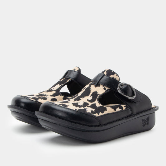 Pair of clogs with black and beige pattern on a white background