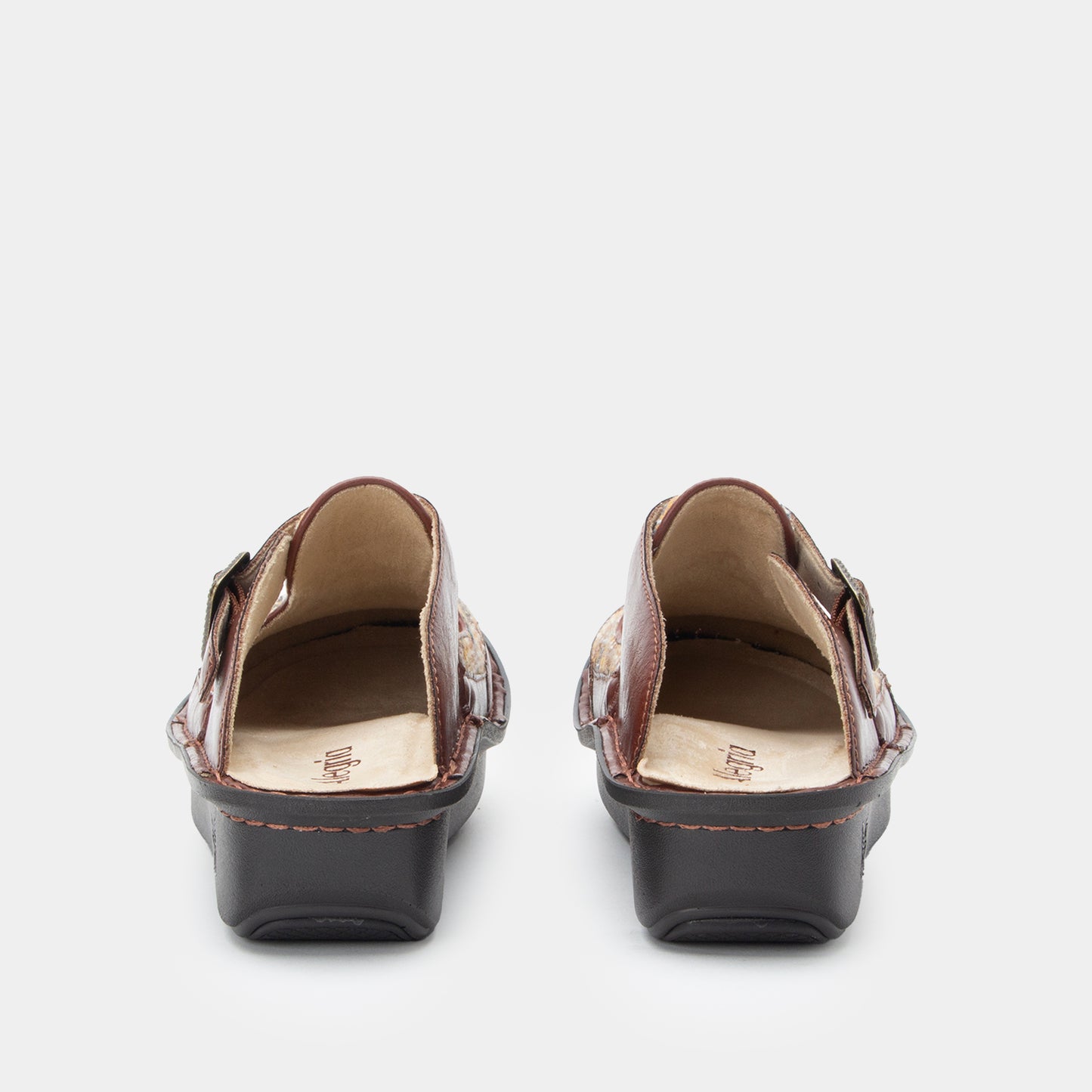 Pair of brown open-toe shoes on a white background