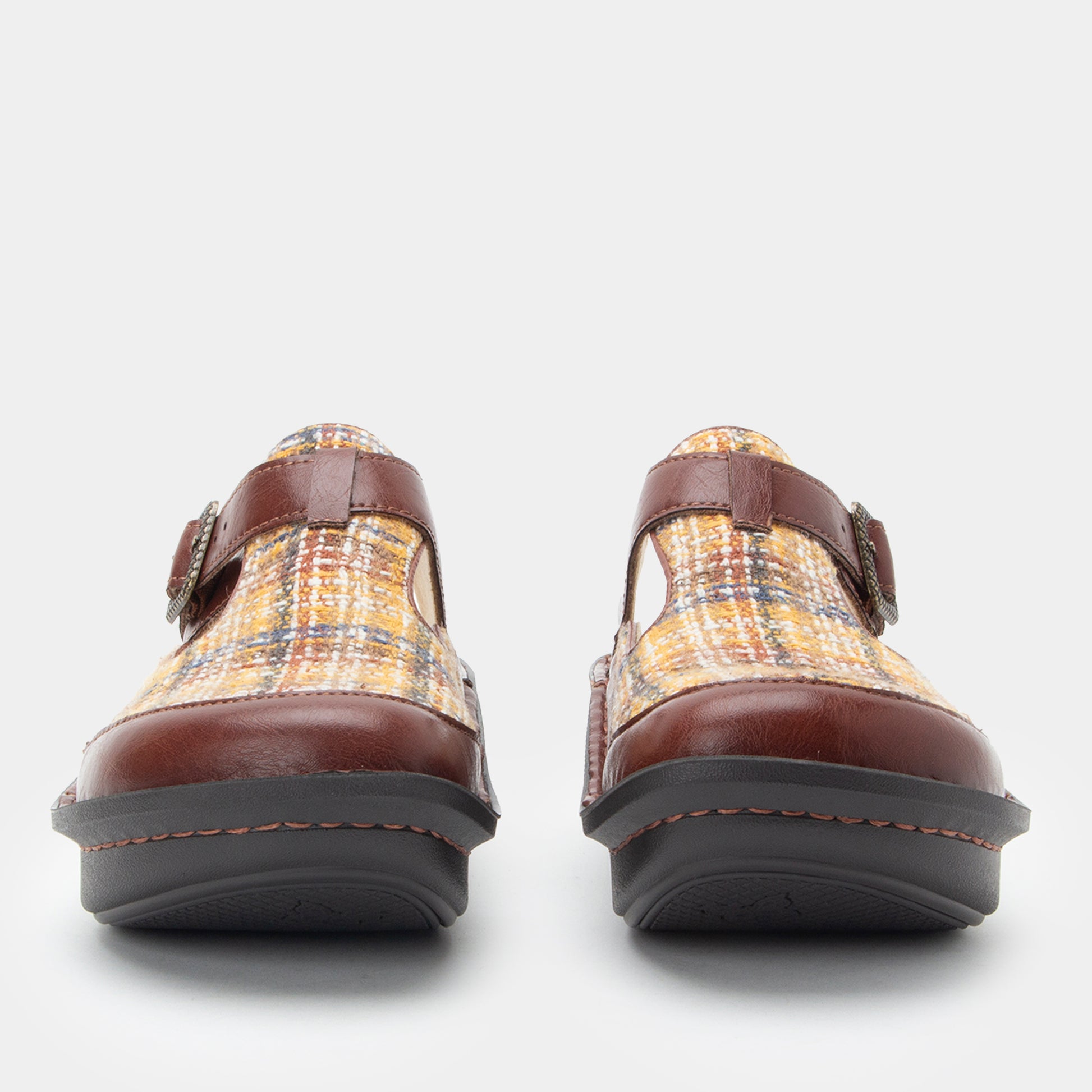 Pair of plaid shoes with brown straps on a white background