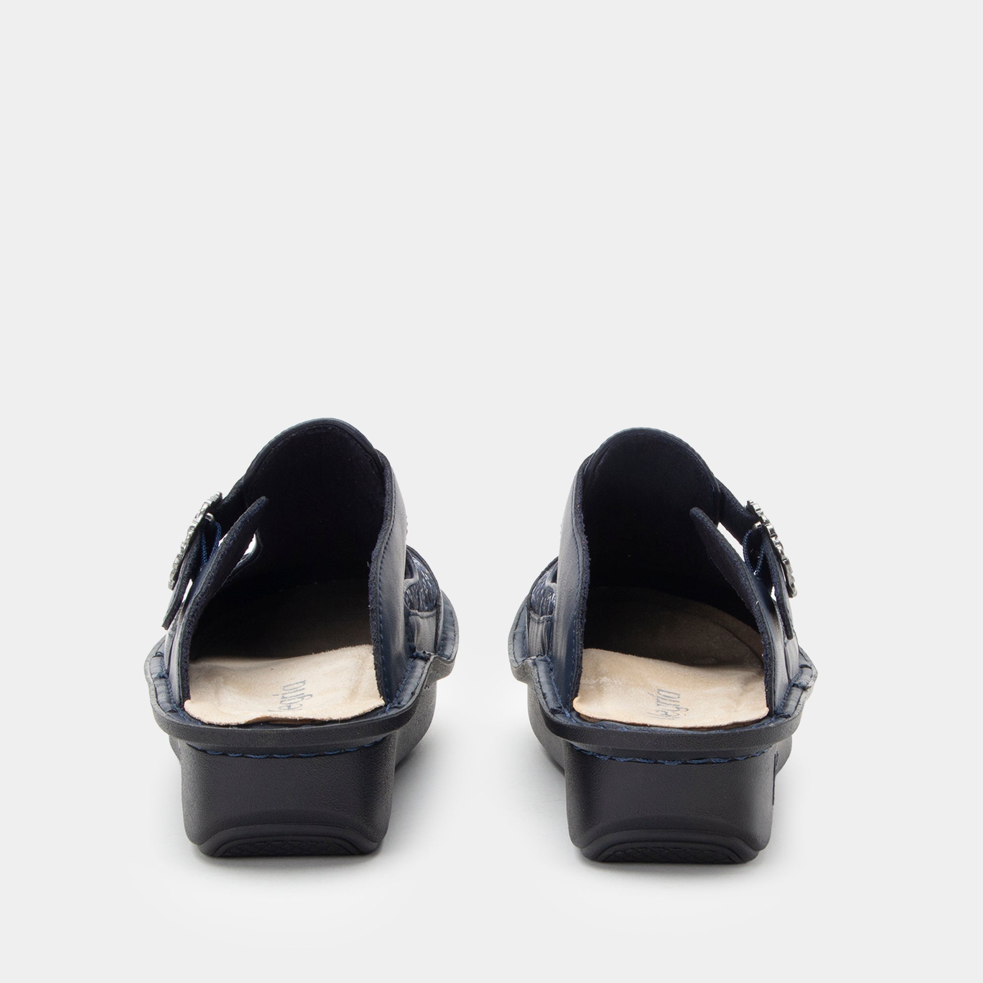 Pair of navy shoes on a white background