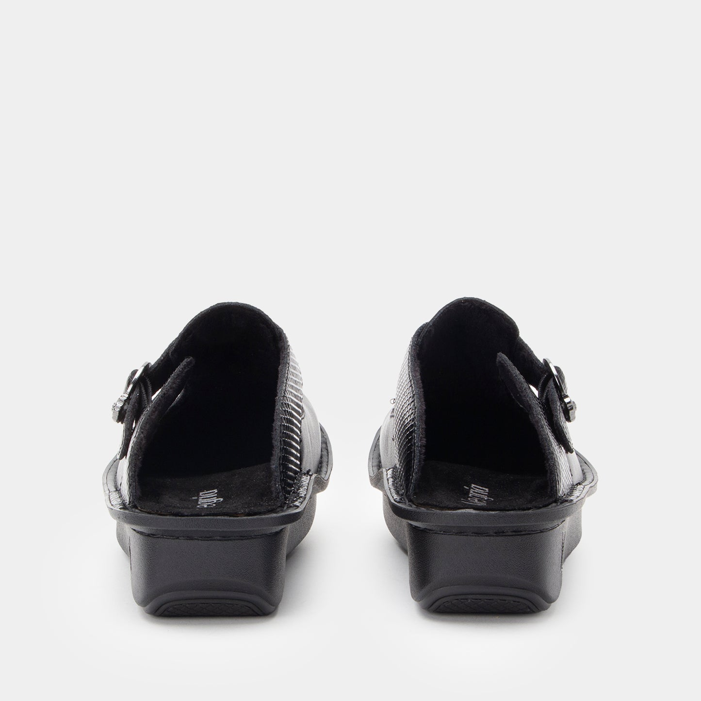 Black shoes with buckles on a white background