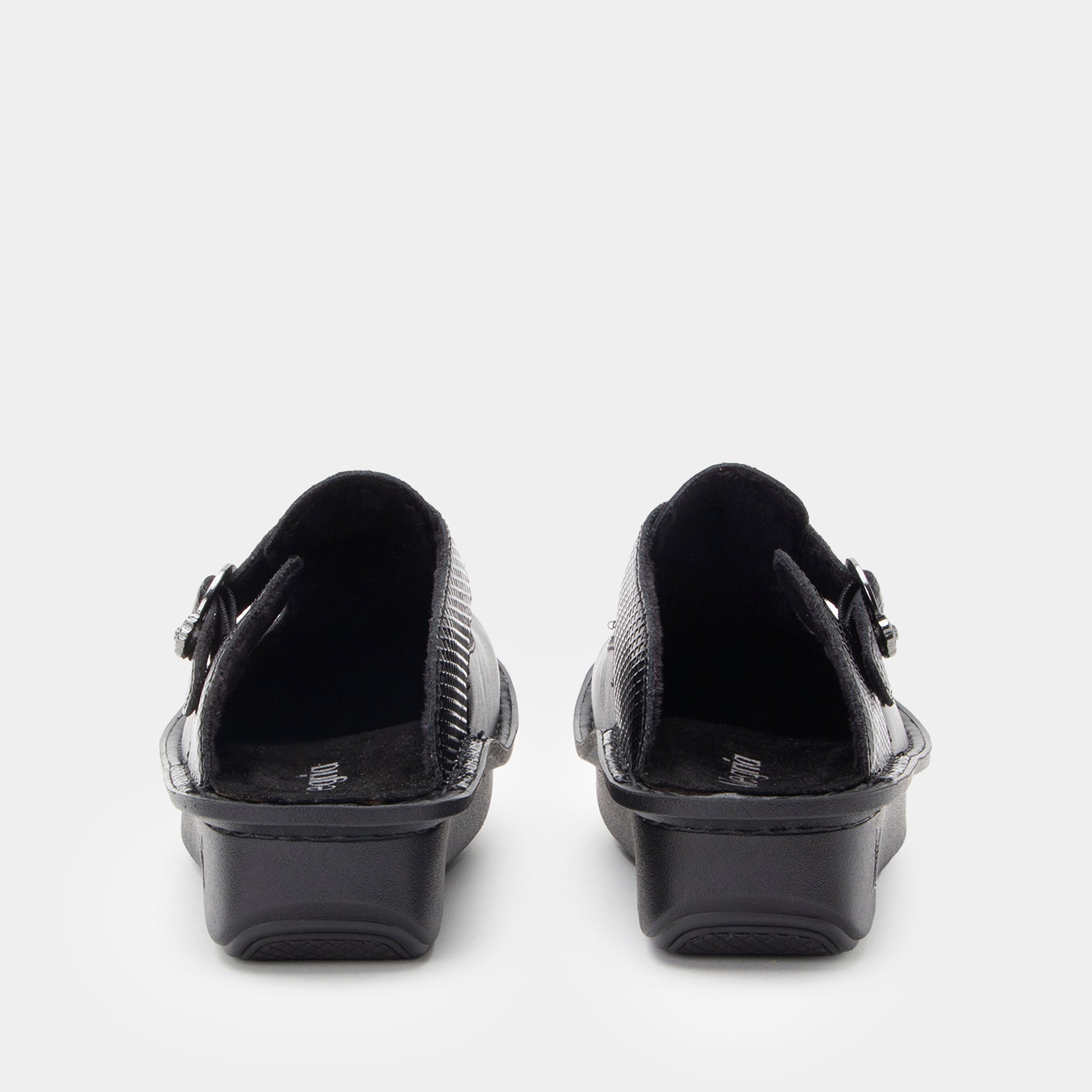 Black shoes with buckles on a white background