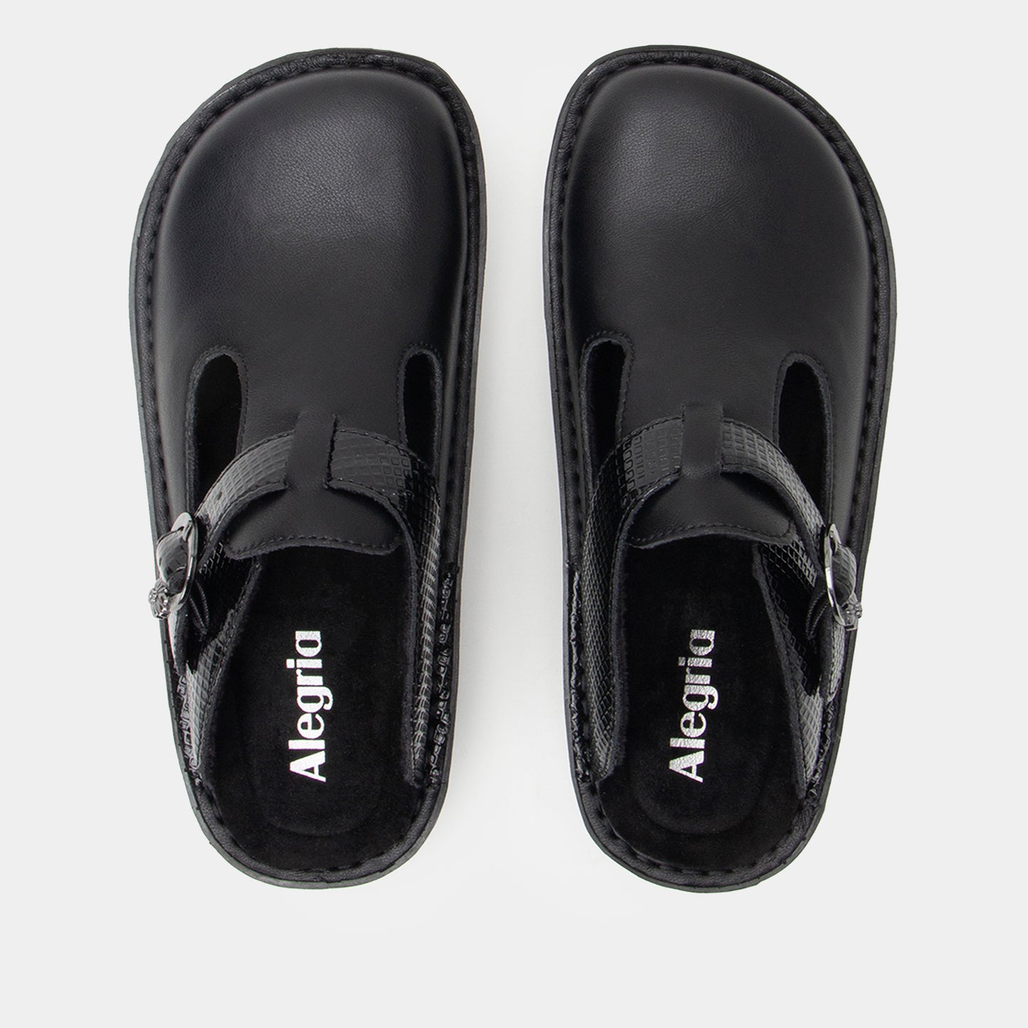 Pair of black clogs with 'Alegria' branding on a white background