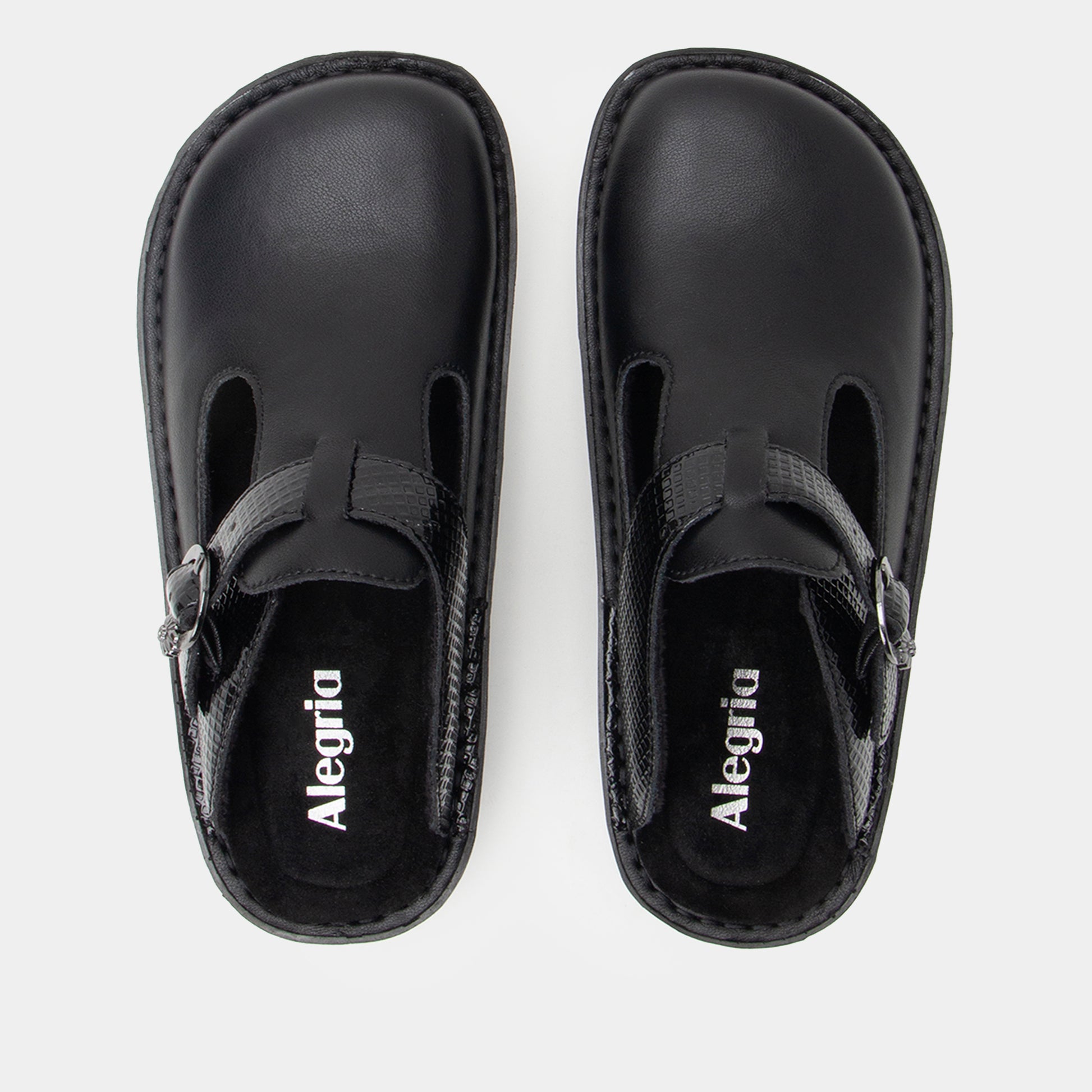 Pair of black clogs with 'Alegria' branding on a white background