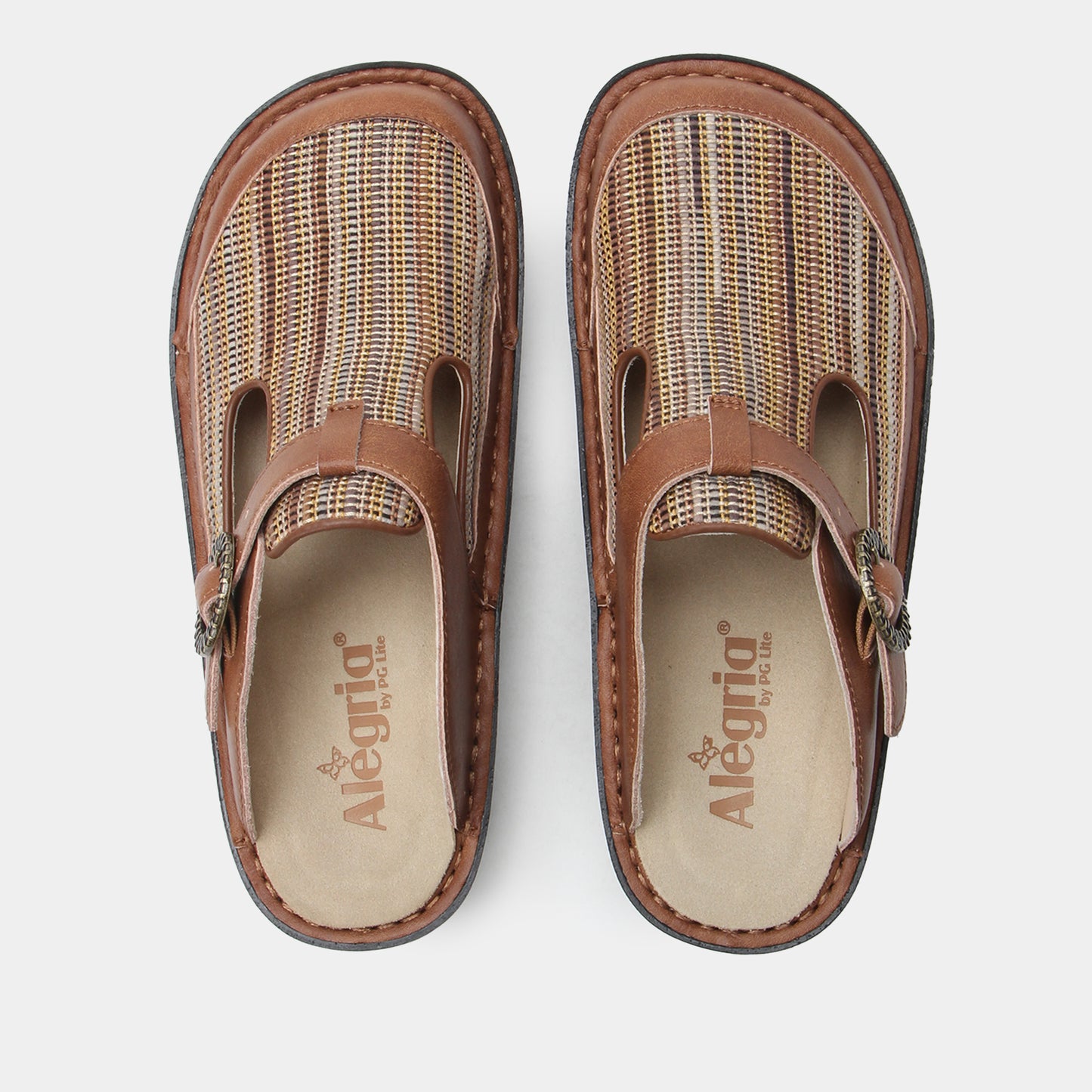 Pair of brown clogs with woven design on a white background