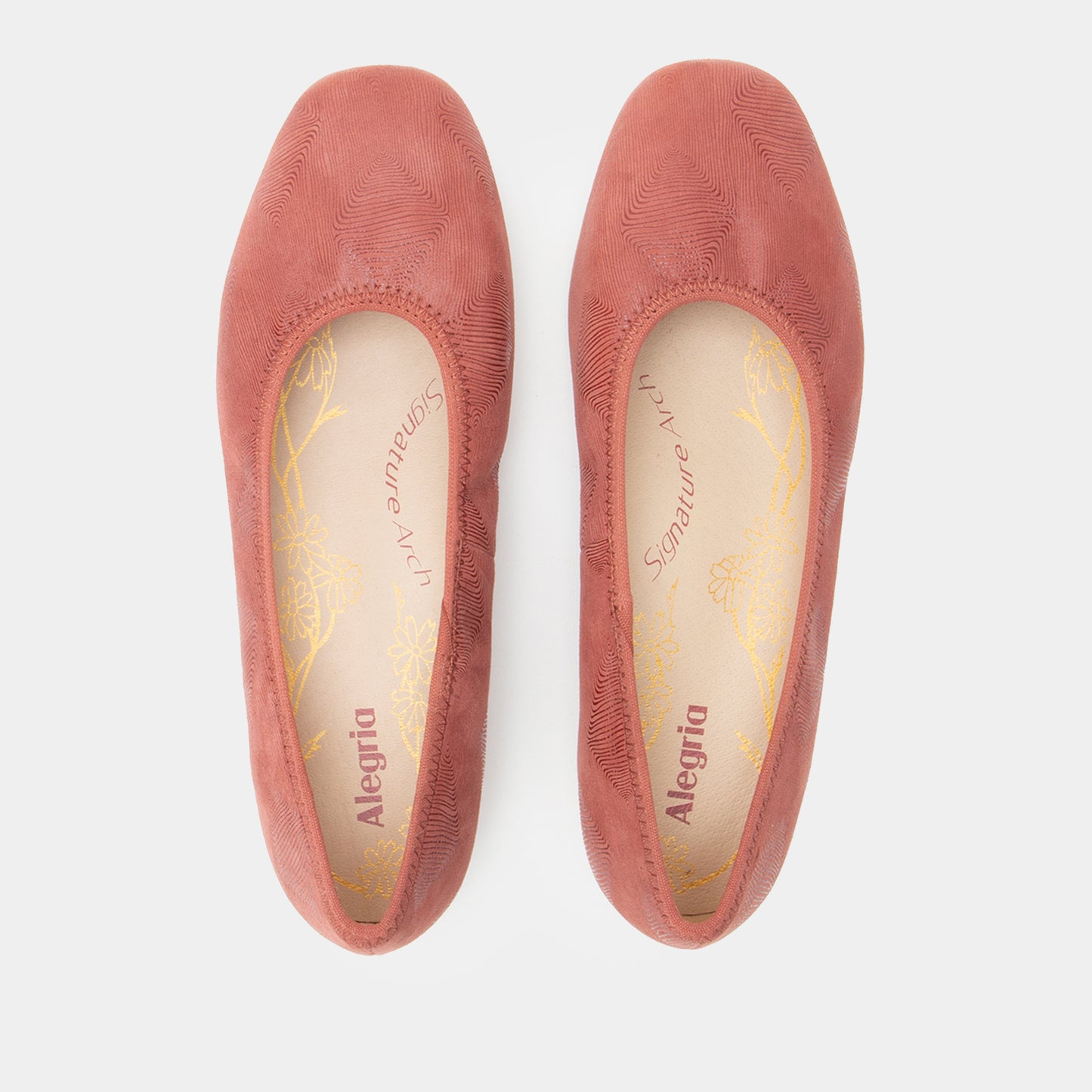 Pair of pink Alegria shoes on a white background