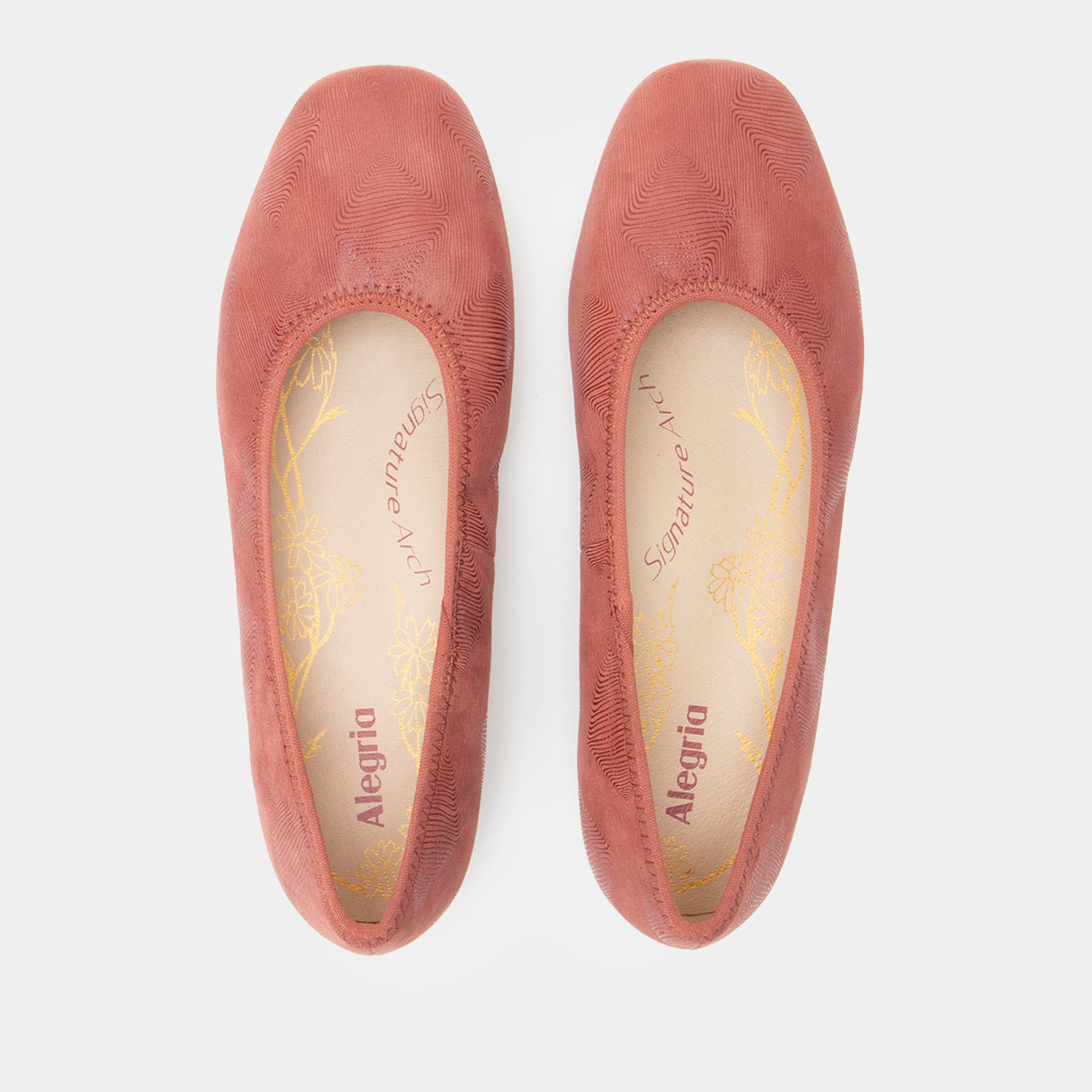 Pair of pink Alegria shoes on a white background