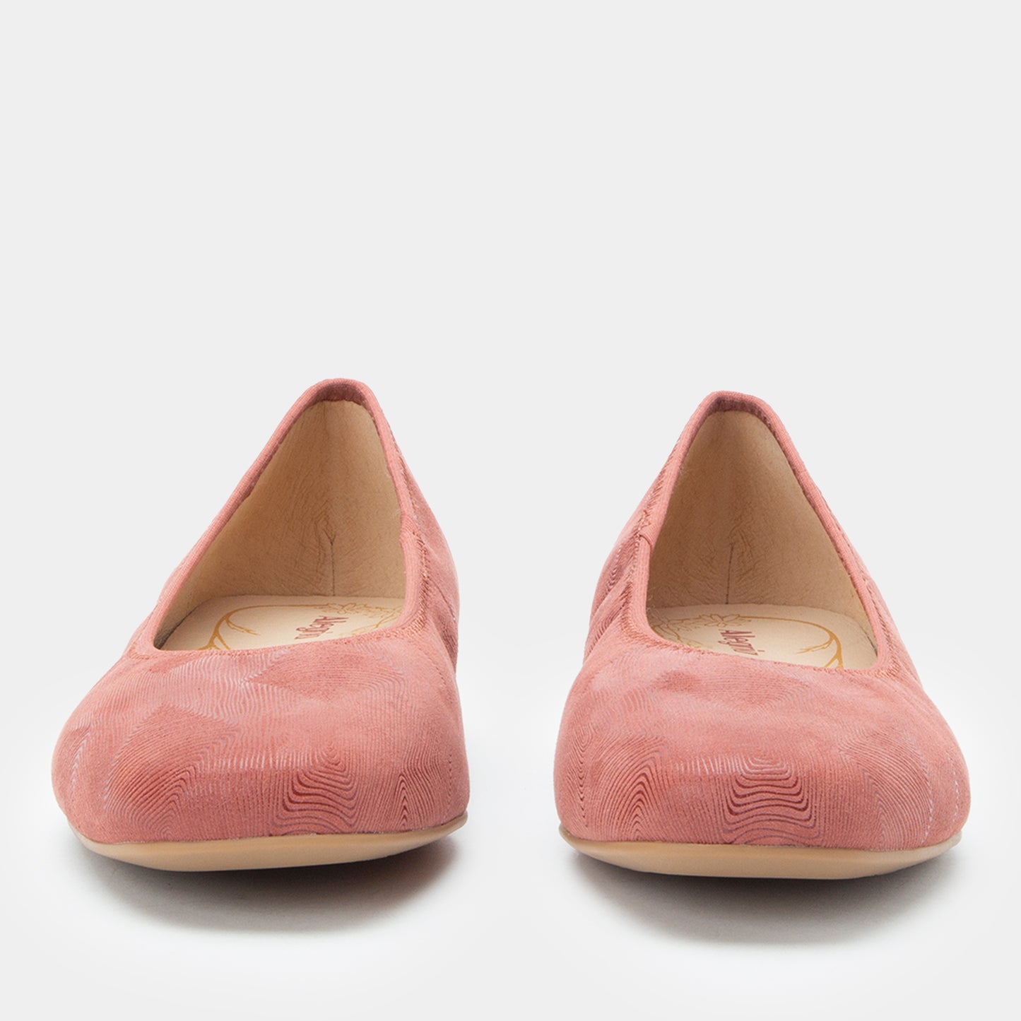 Pair of pink suede shoes on a white background