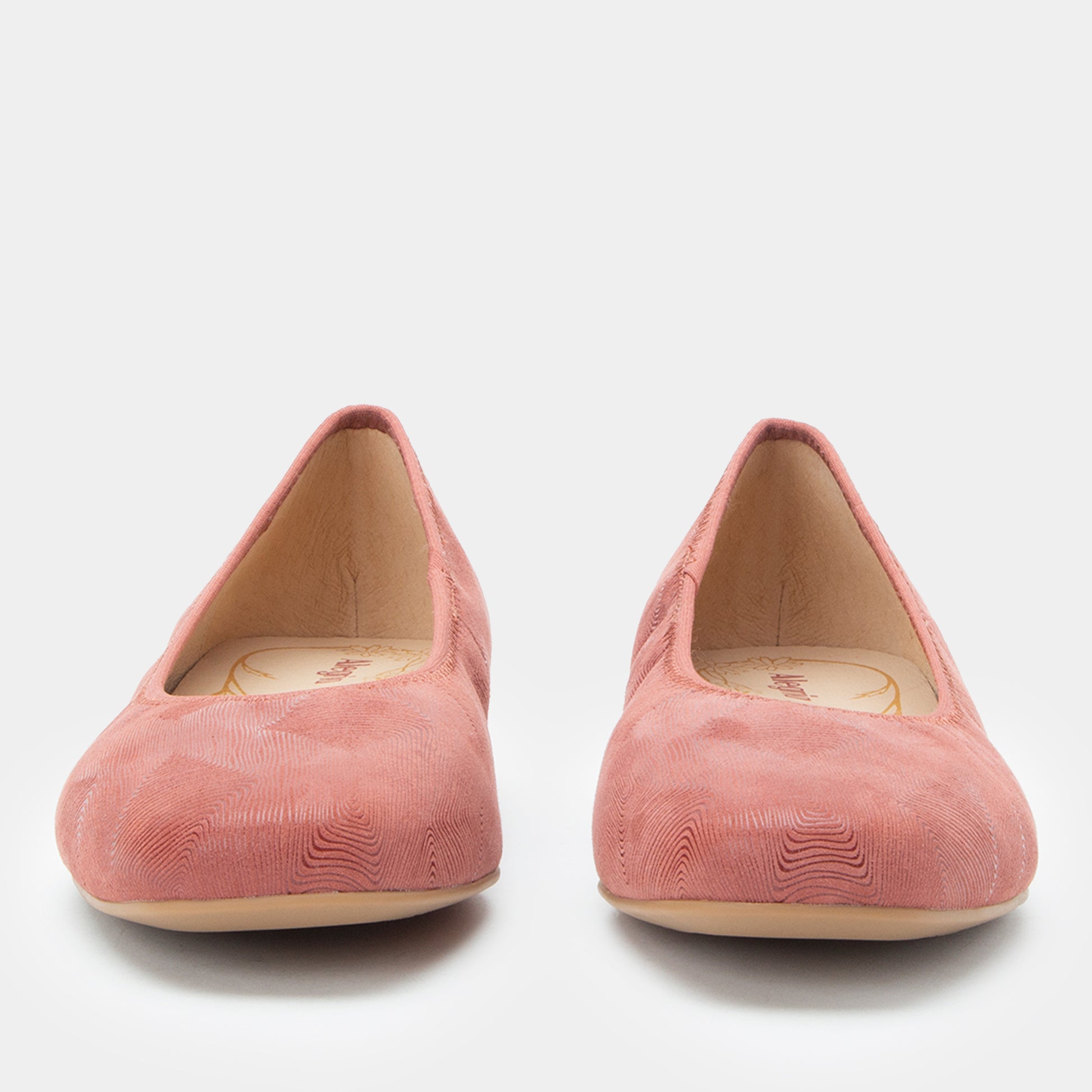 Pair of pink suede shoes on a white background
