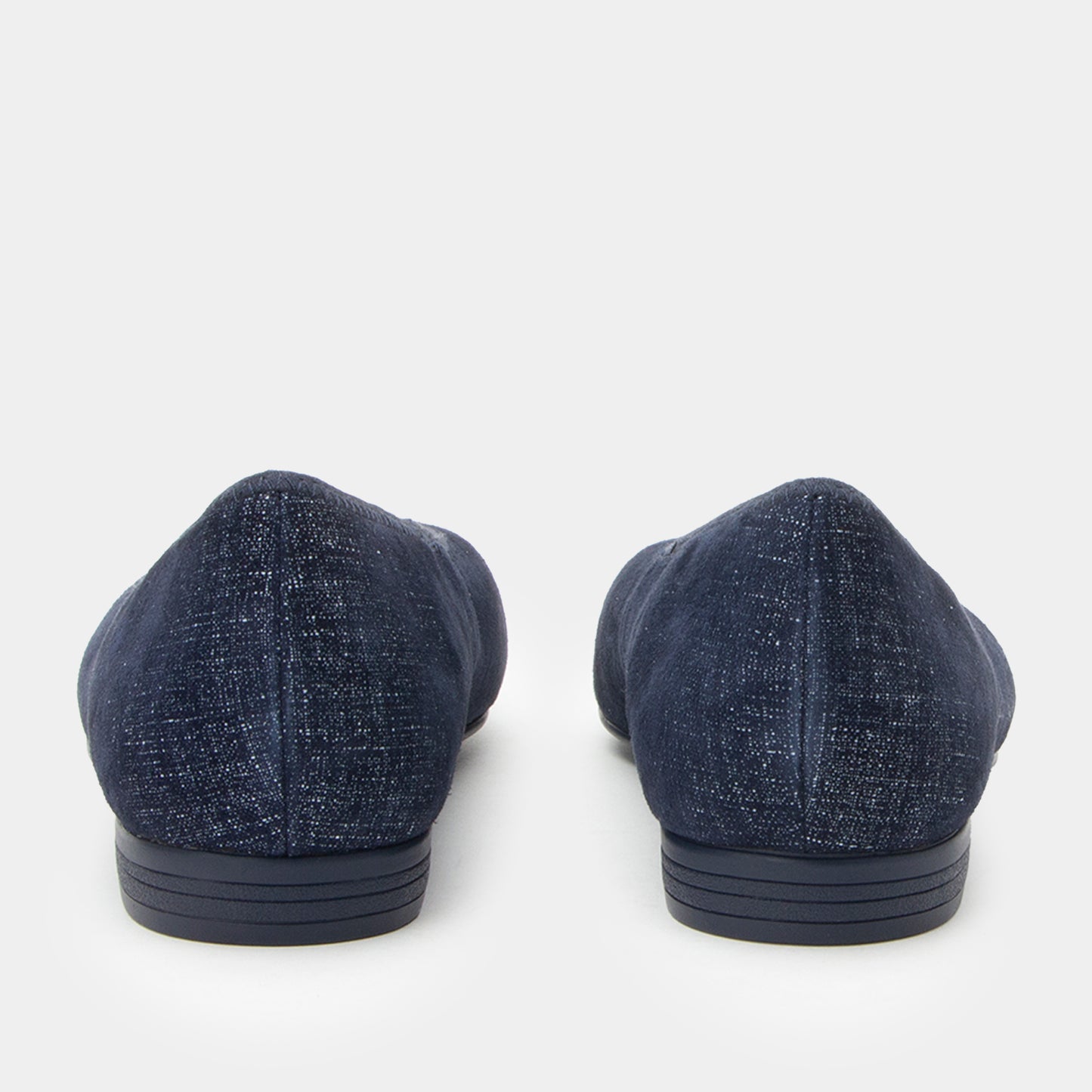 Pair of blue loafers on a white background