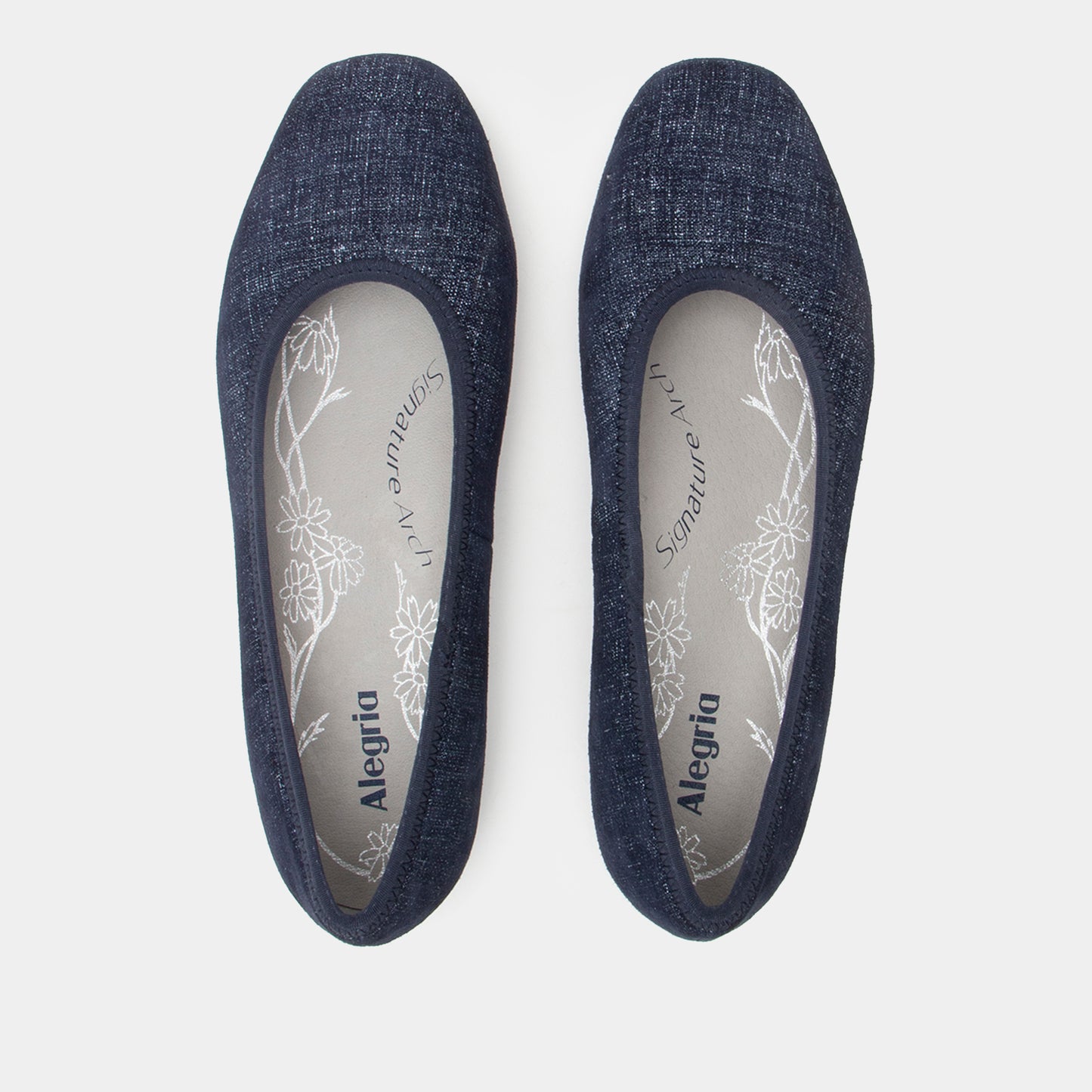 Pair of navy blue flats with 'Alegria' branding on a light gray background