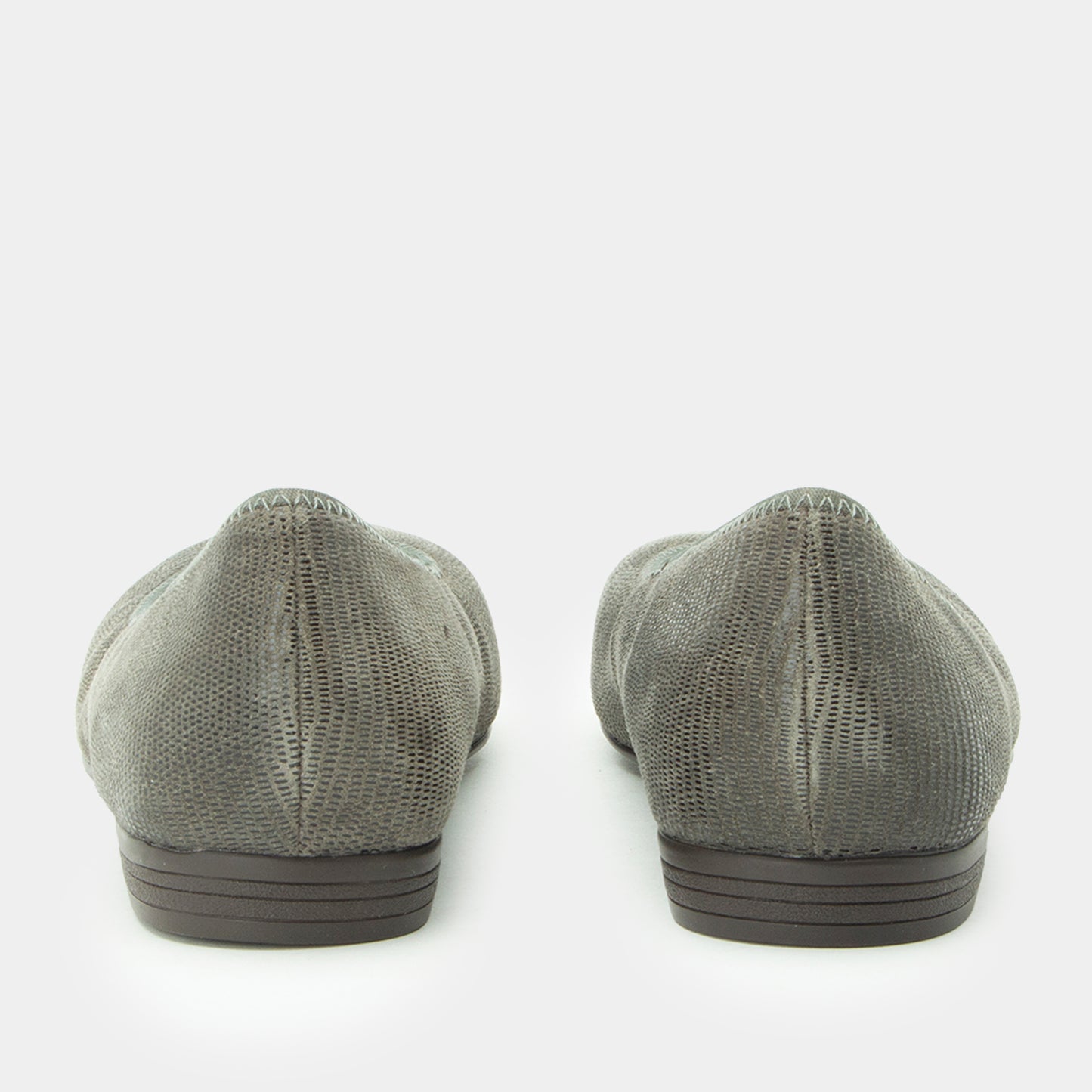 Pair of gray flat shoes on a white background