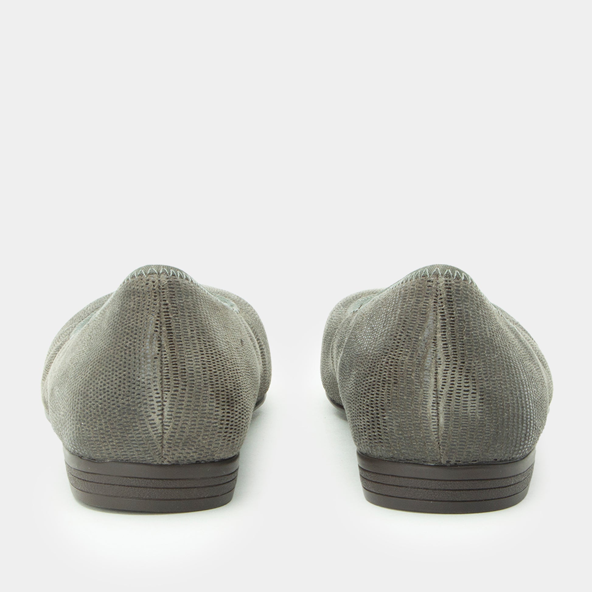 Pair of gray flat shoes on a white background