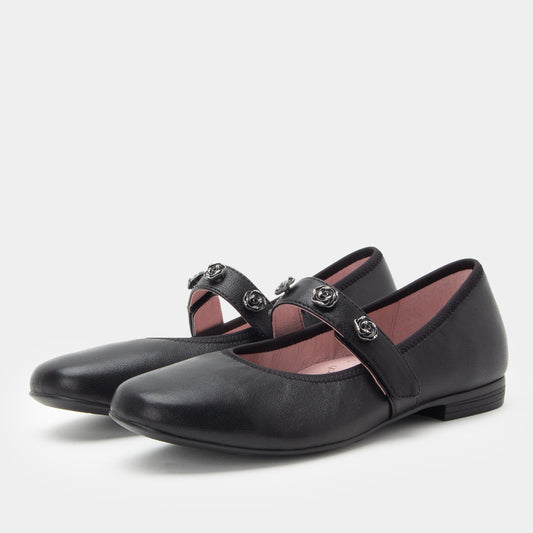 Pair of black shoes with decorative straps on a white background