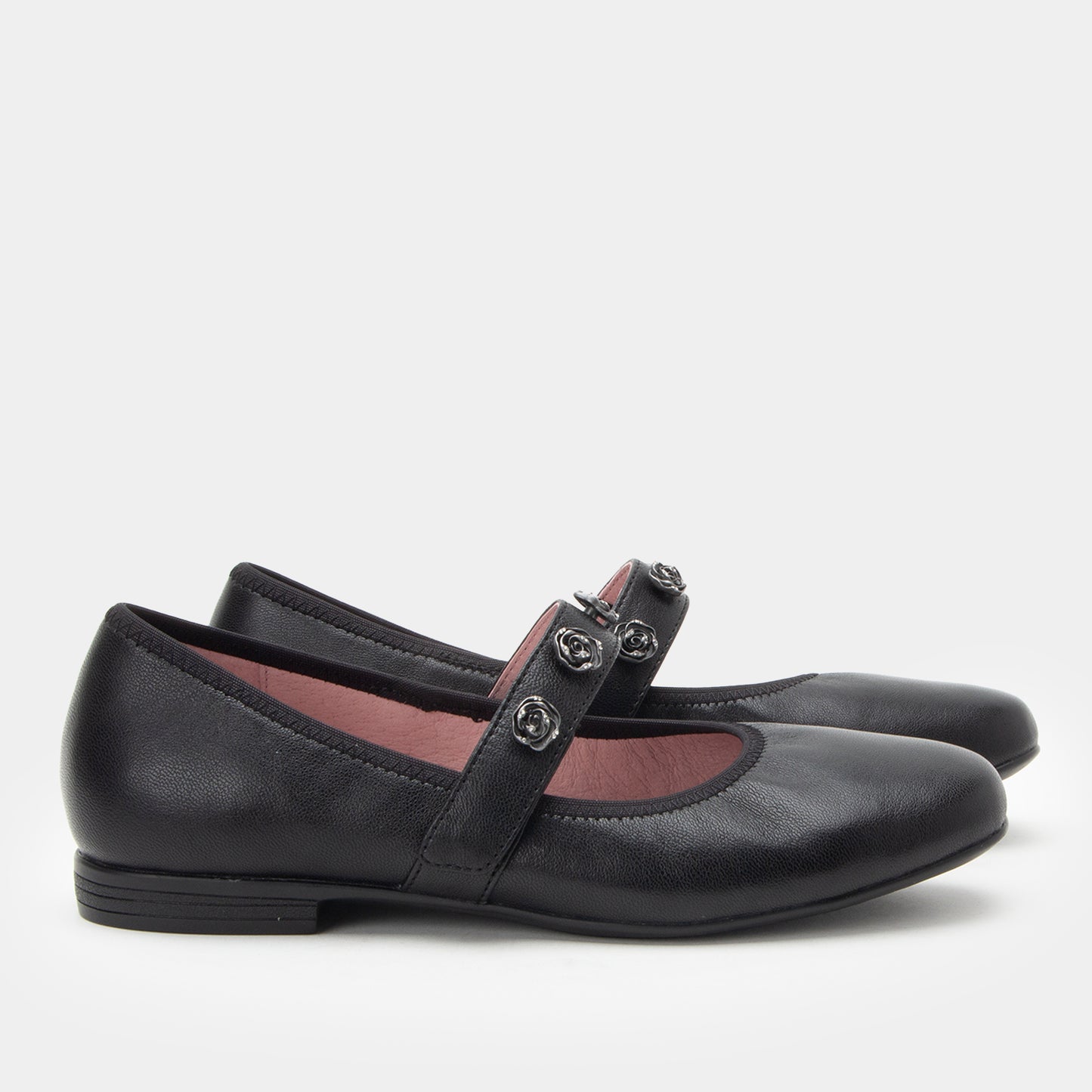 Black leather shoes with a strap on a white background
