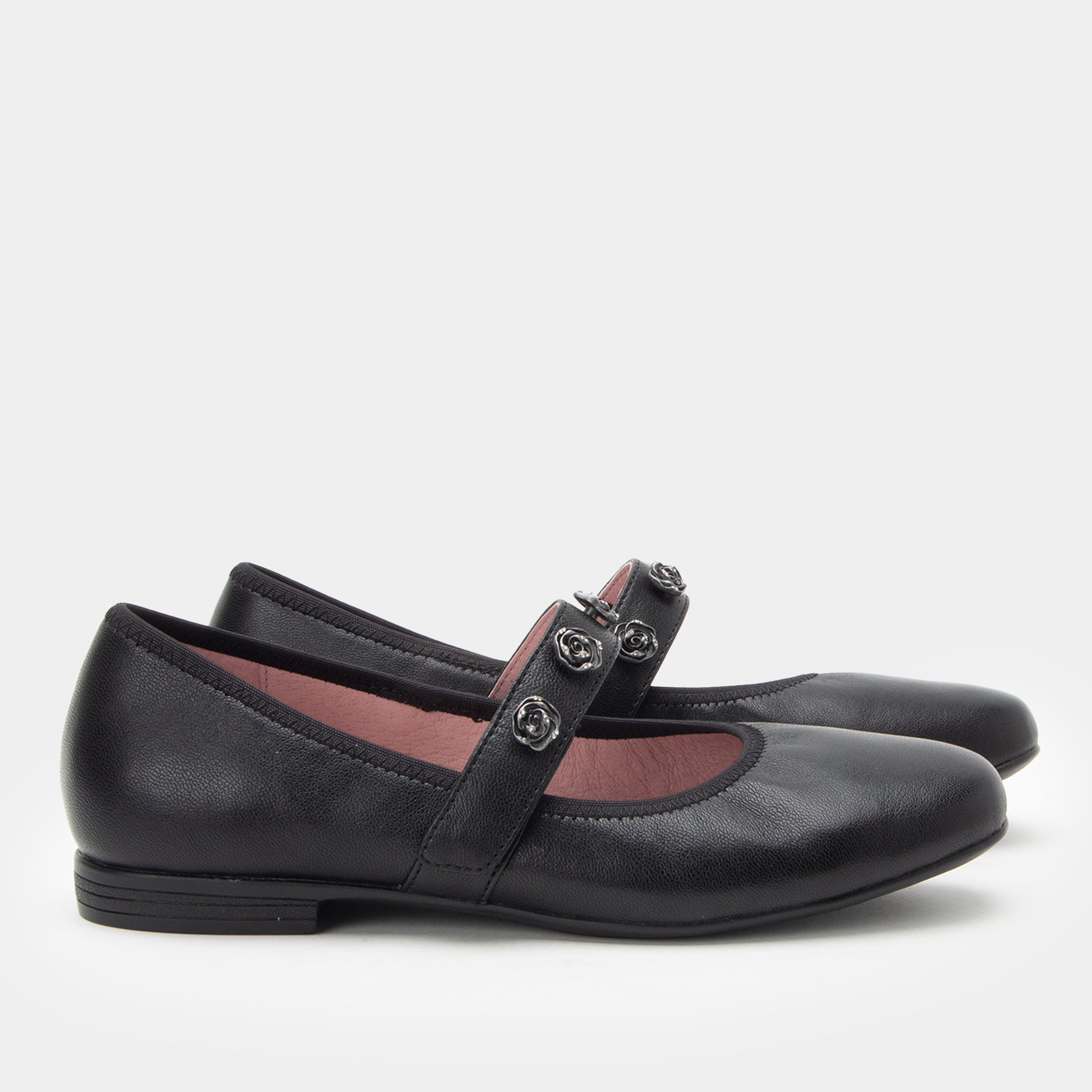 Black leather shoes with a strap on a white background