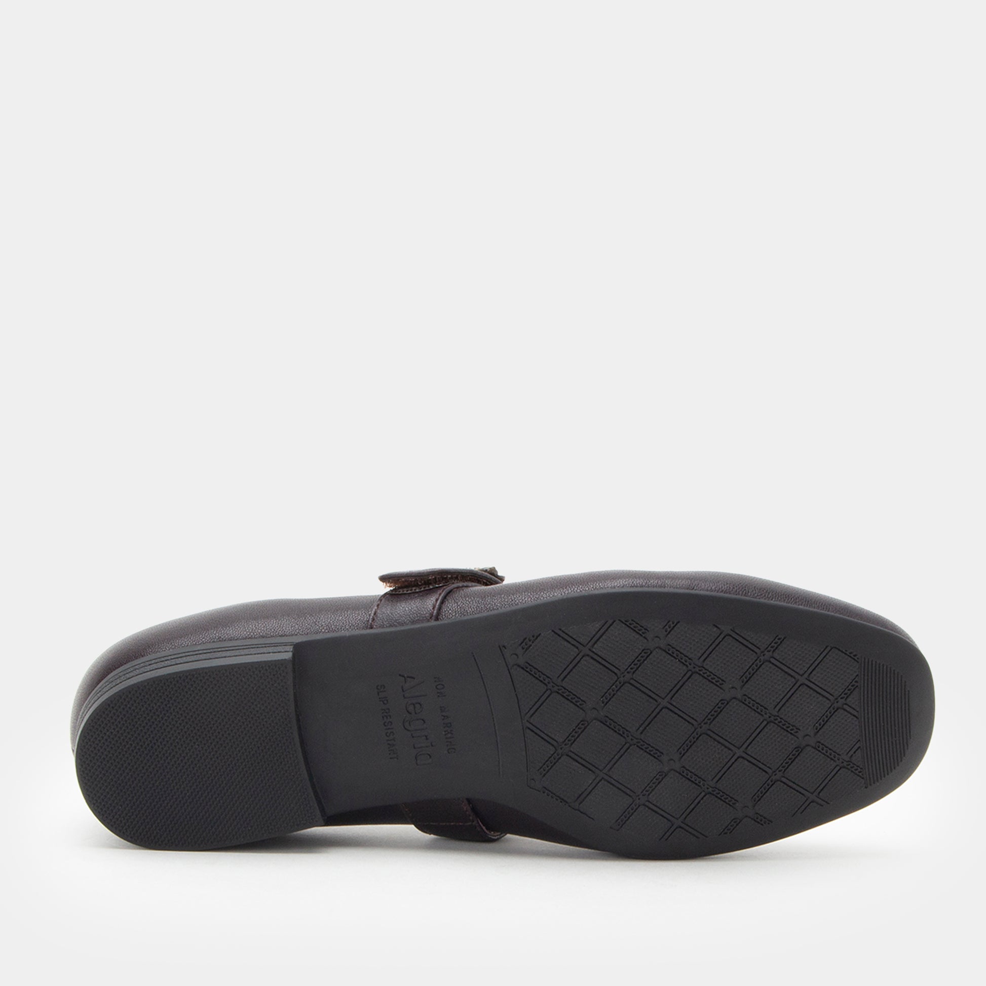 Black shoe sole with tread pattern on a white background