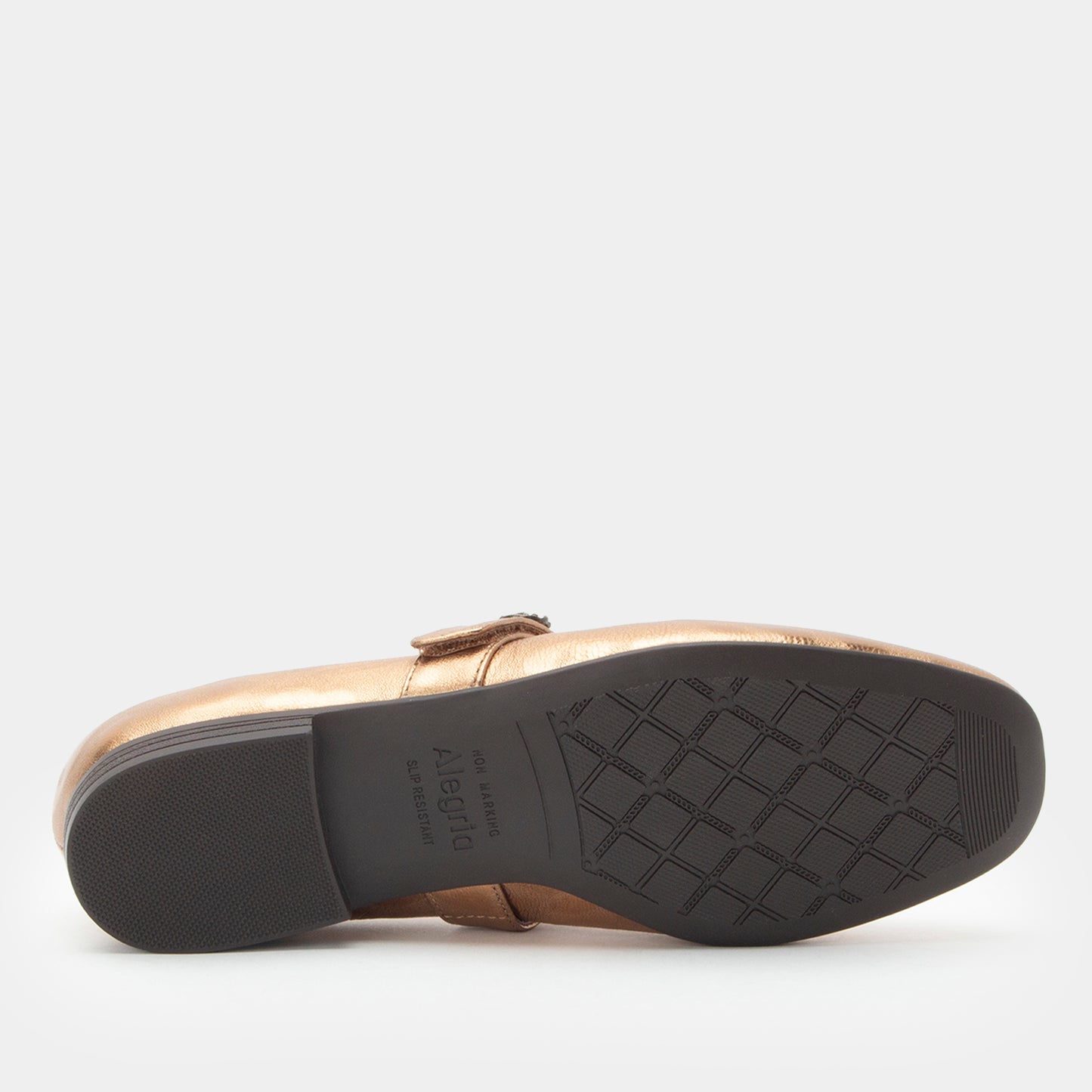 Gold shoe with black sole on a white background