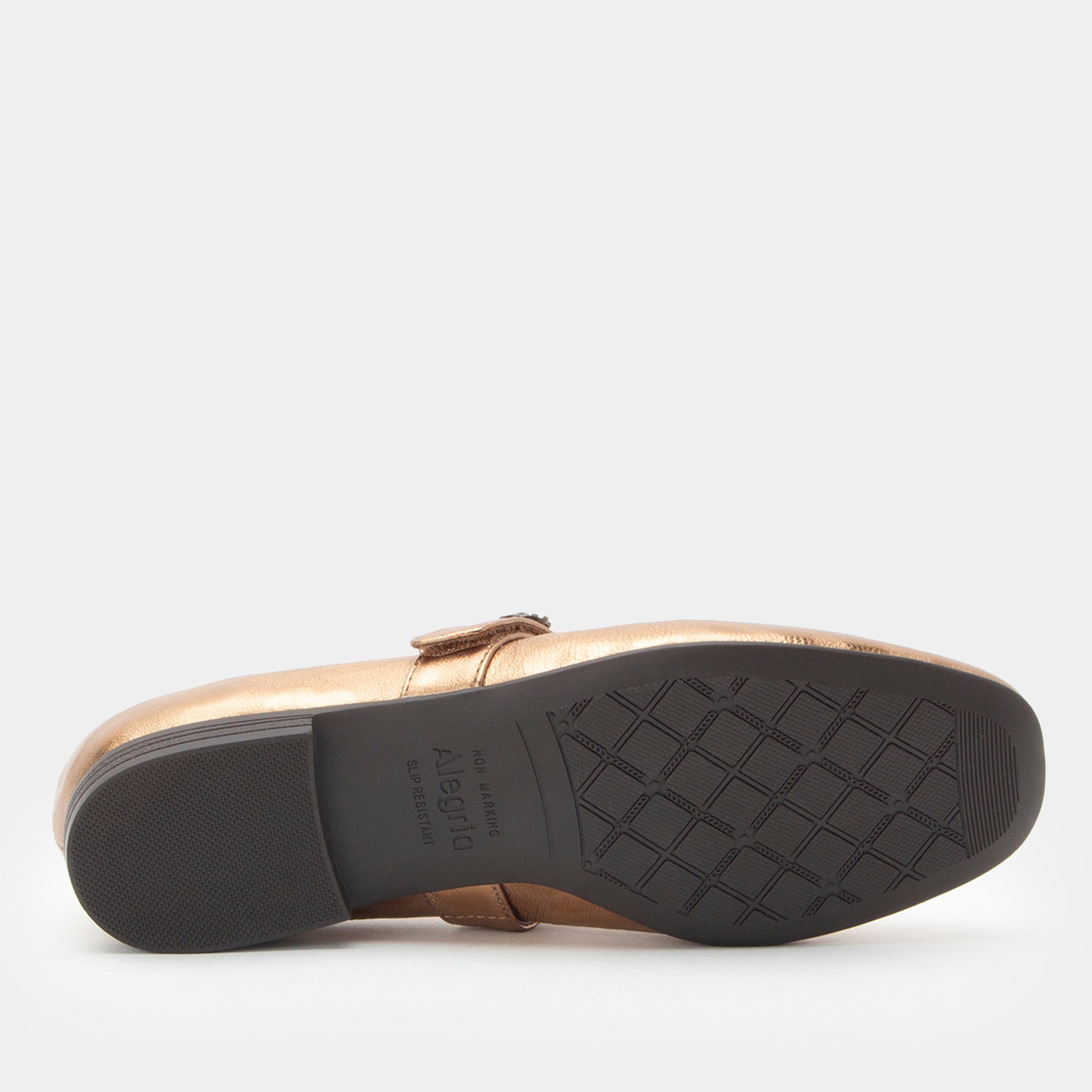 Gold shoe with black sole on a white background