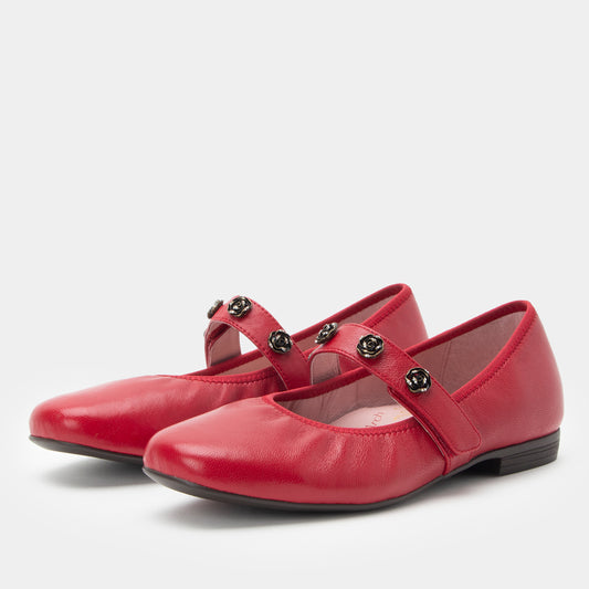 Red leather shoes with straps on a white background