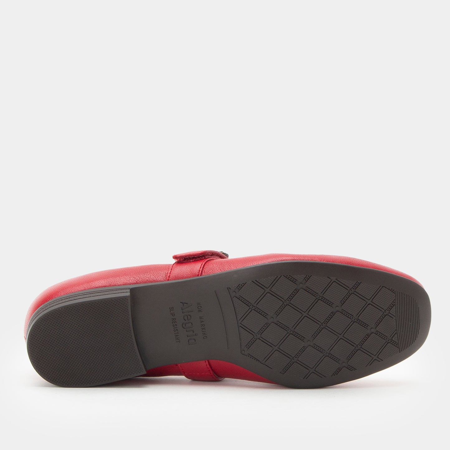 Red loafer shoe with a black sole on a white background