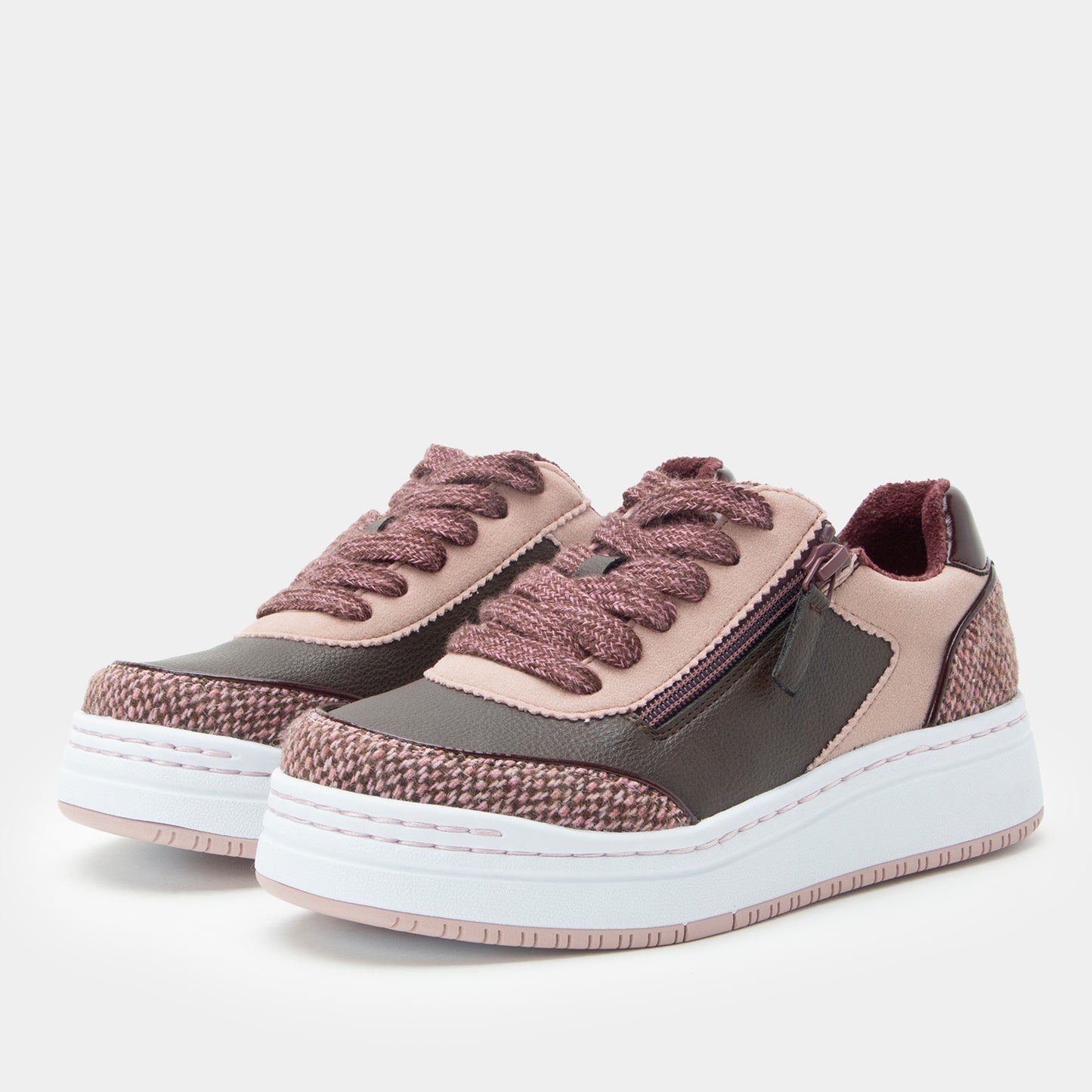 Pair of brown and gray sneakers with white soles on a light gray background