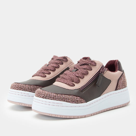 Pair of brown and gray sneakers with white soles on a light gray background