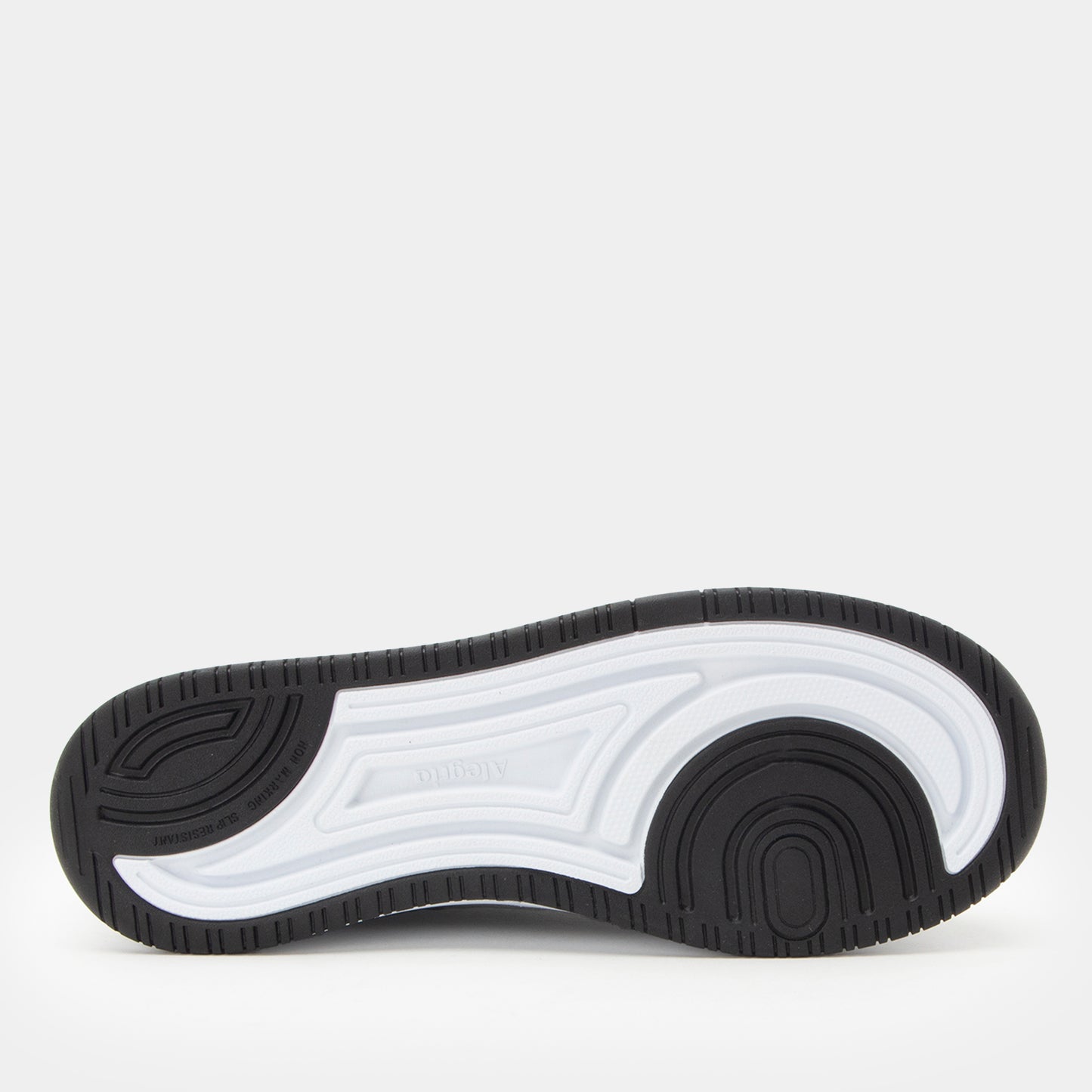 Black and white sneaker sole on a light gray background